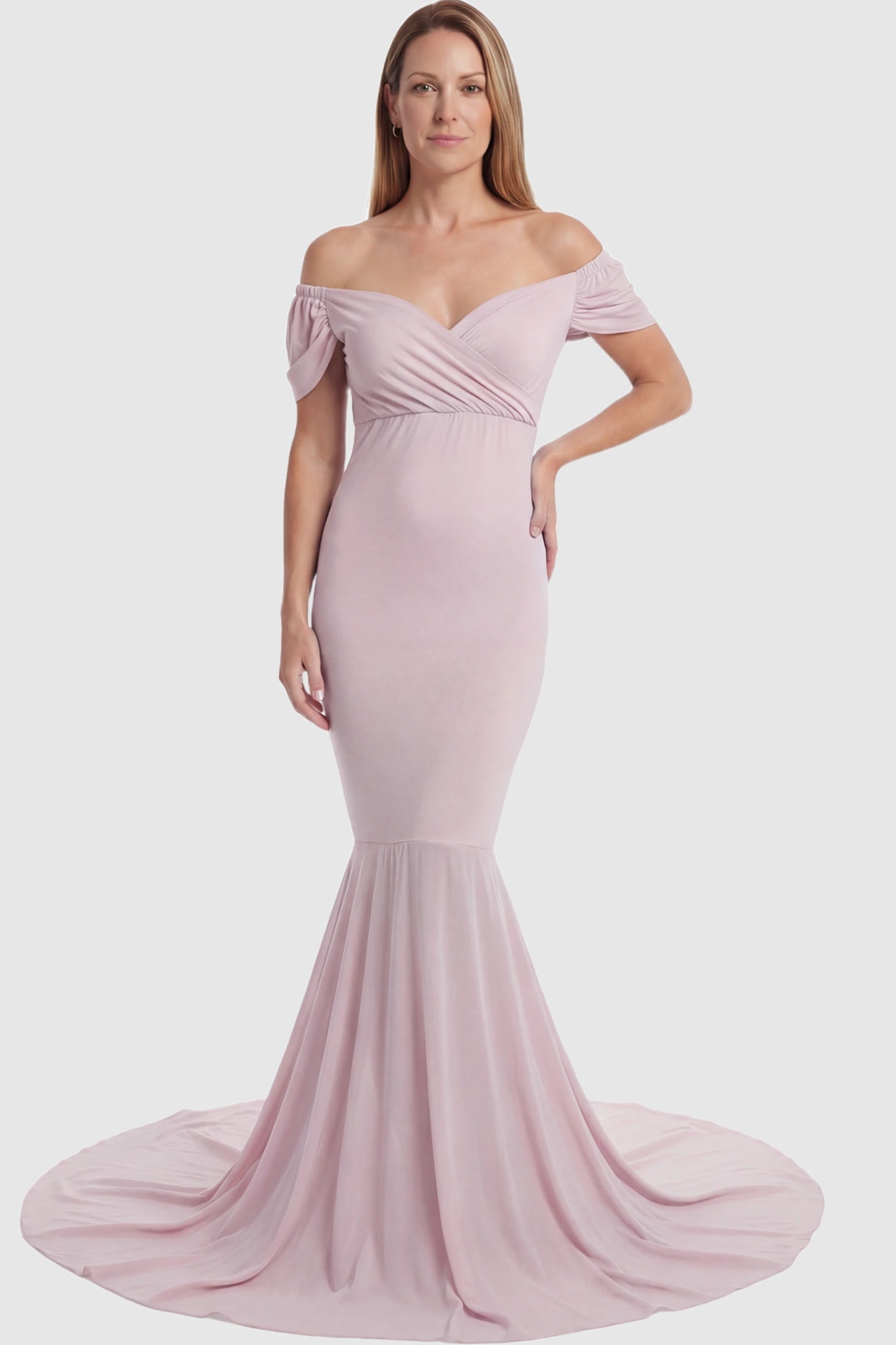 Solid Off Shoulder Fitted Maternity Photoshoot Gown Solid Off Shoulder Fitted Maternity Photoshoot Gown in pink featuring a sweetheart cross-front bodice and flowing chiffon train on a postpartum model.