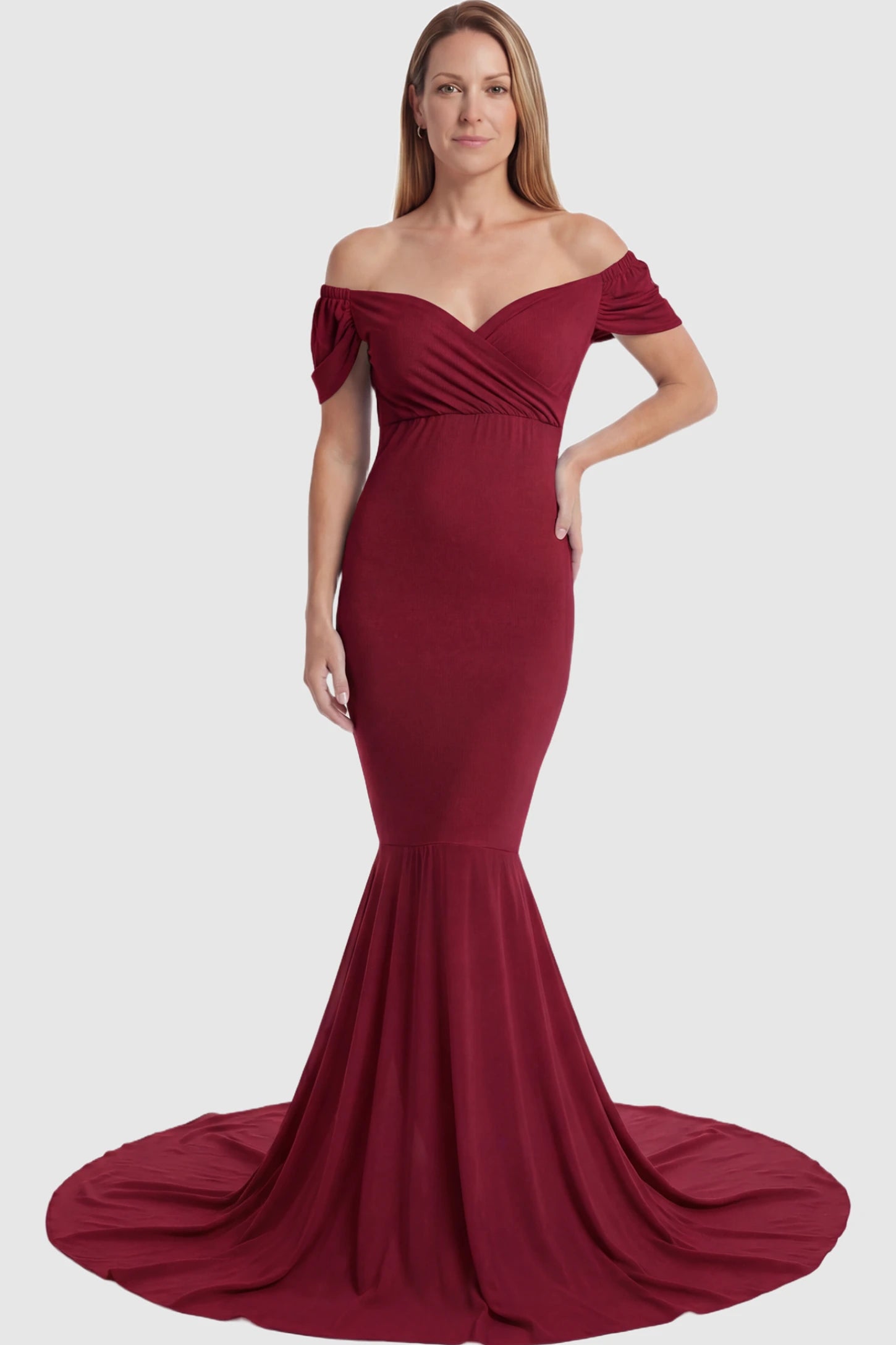 Solid Off Shoulder Fitted Maternity Photoshoot Gown Solid Off Shoulder Fitted Maternity Photoshoot Gown in red featuring a sweetheart cross-front bodice and flowing chiffon train on a postpartum model.