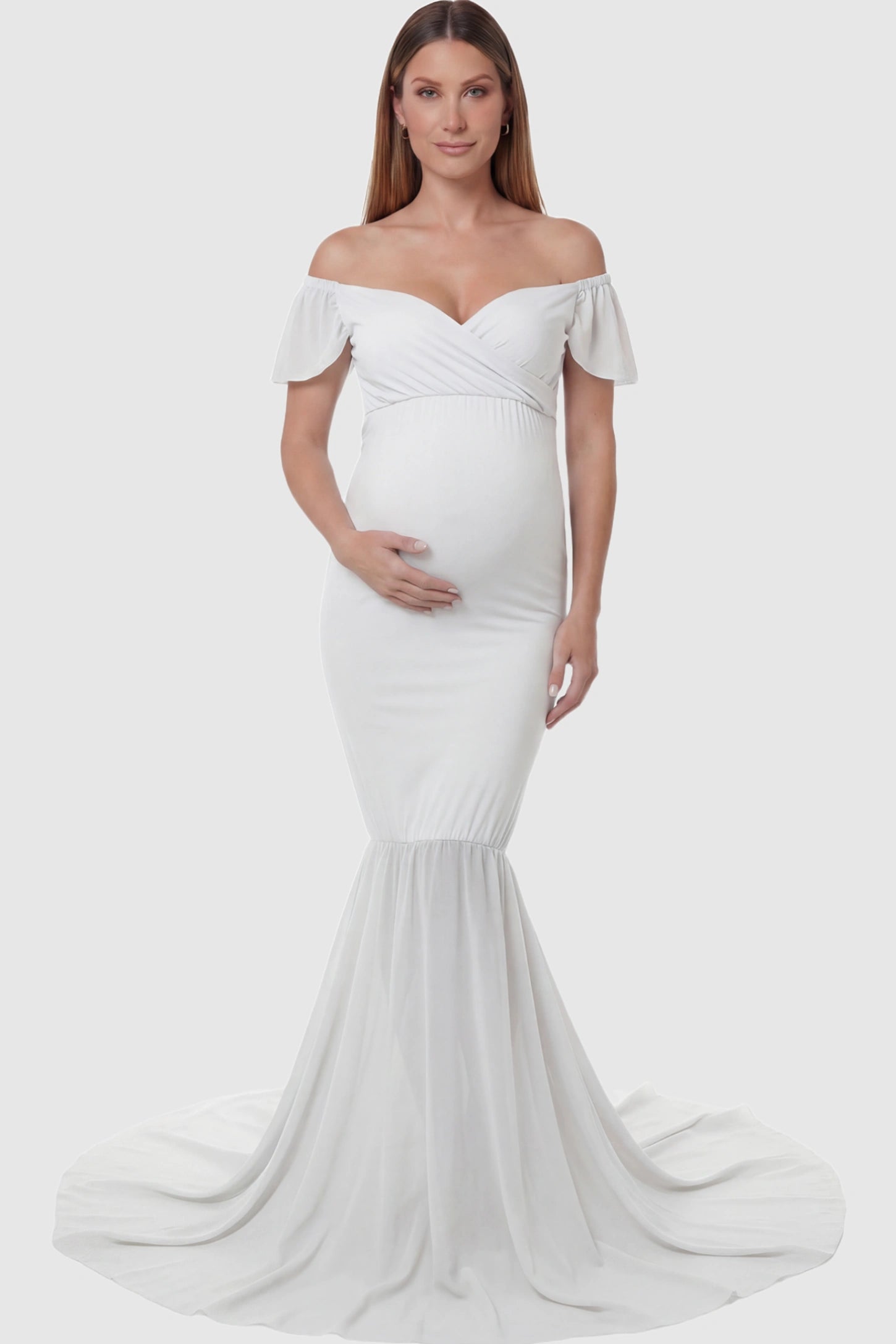 Solid Off Shoulder Fitted Maternity Photoshoot Gown in white featuring a sweetheart cross-front bodice and flowing chiffon train on a pregnant model.