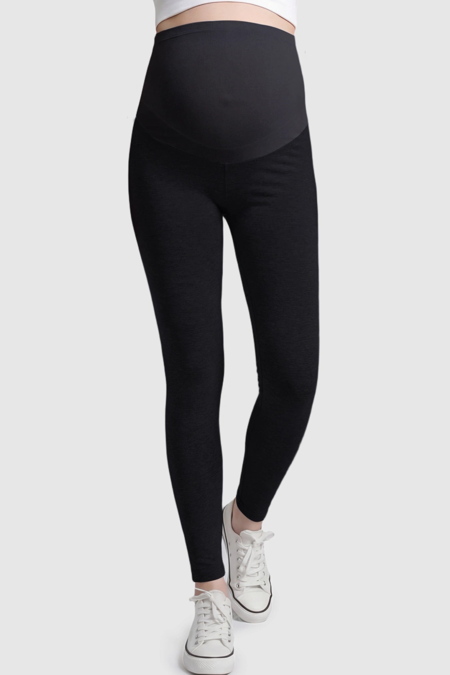 High Waist Full Panel Stretch Fit Maternity Leggings in Black featuring a seamless over-the-belly panel on a pregnant model.