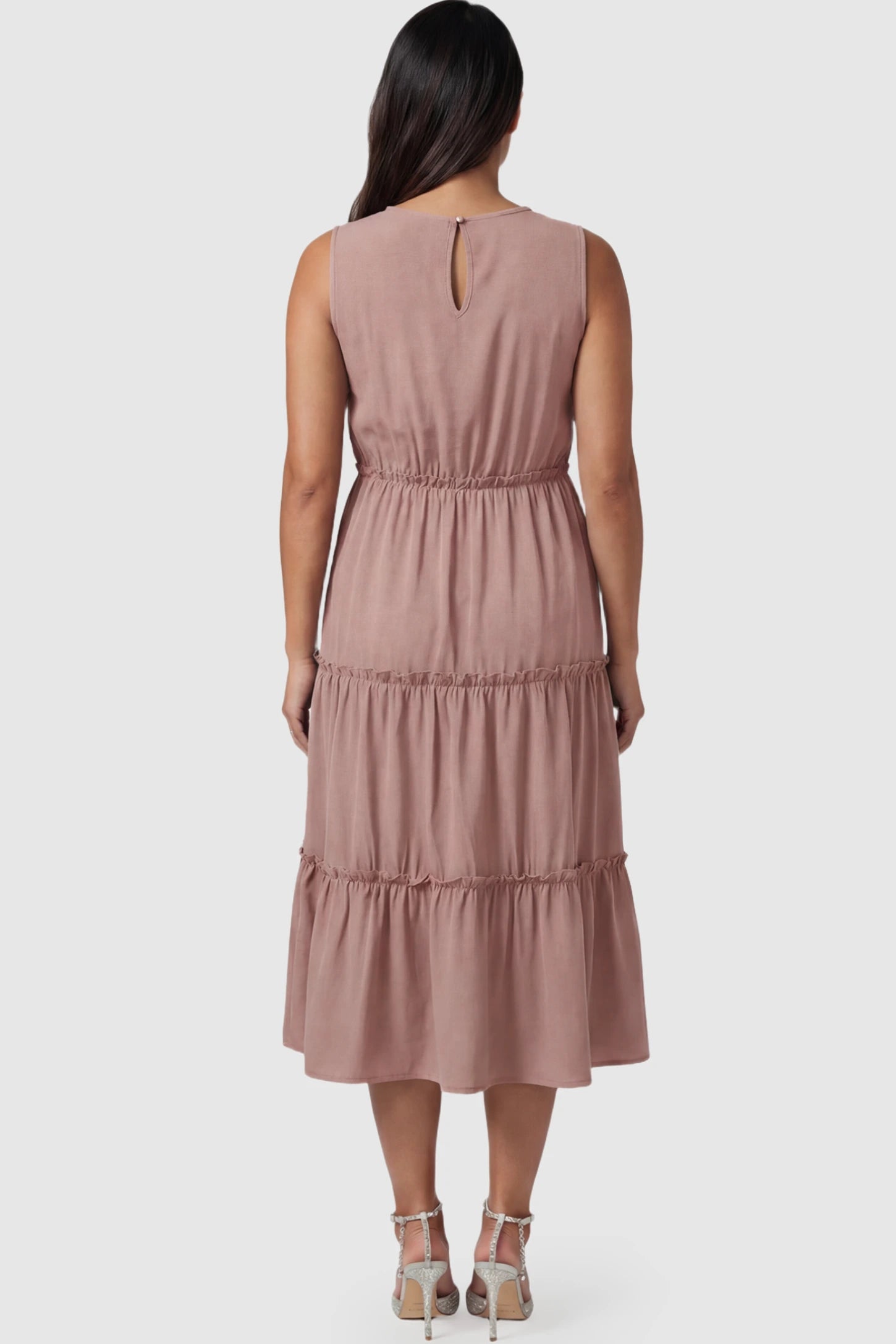 Solid Sleeveless Ruffle Tiered Maternity Midi Dress Solid Sleeveless Ruffle Tiered Maternity Midi Dress in Mauve featuring a ruffle tiered skirt on a pregnant model.