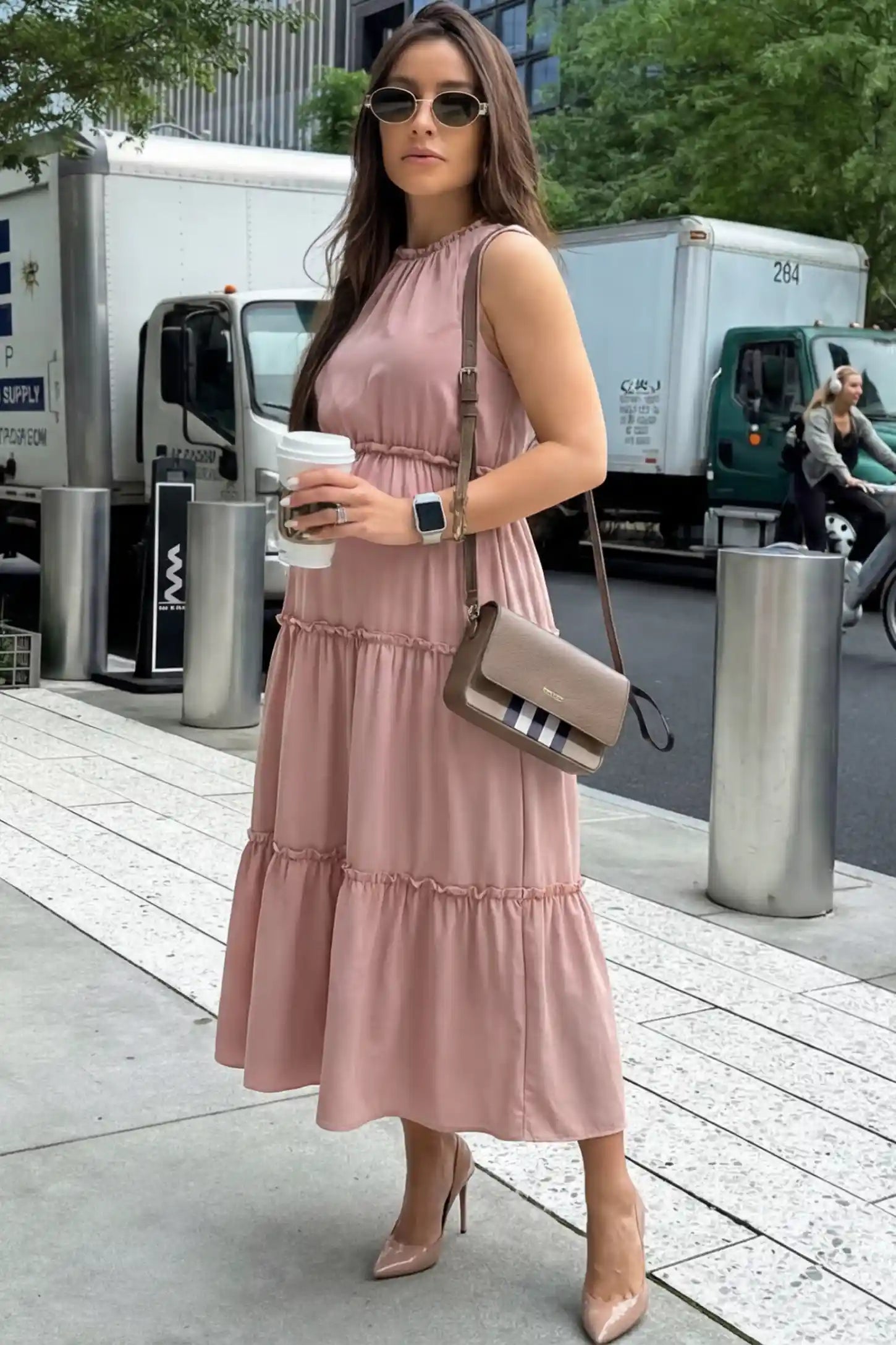 Solid Sleeveless Ruffle Tiered Maternity Midi Dress in Mauve featuring a ruffle tiered skirt on a pregnant model.