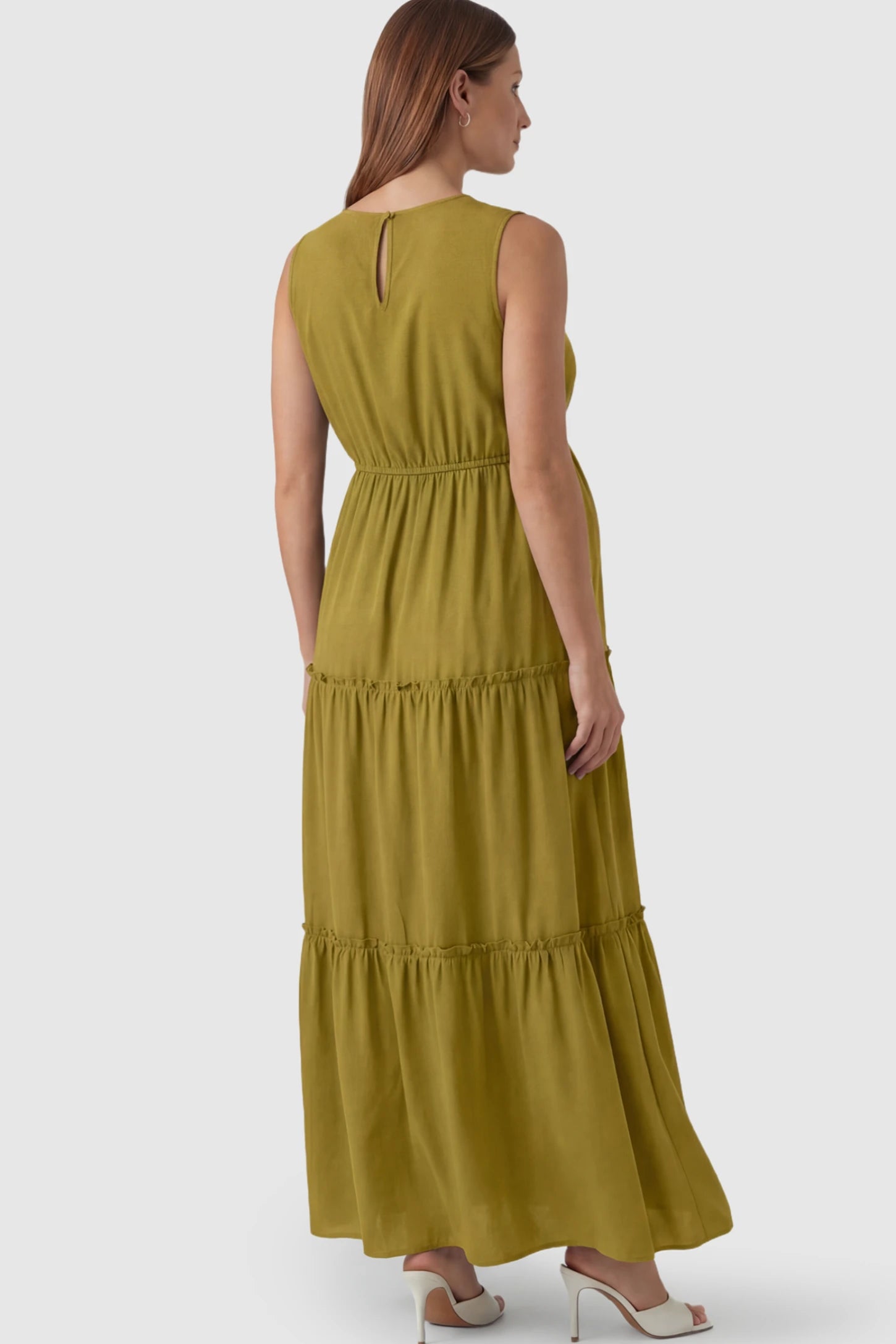 Solid Sleeveless Ruffle Tiered Maternity Midi Dress Solid Sleeveless Ruffle Tiered Maternity Midi Dress in Olive Green featuring a ruffle tiered skirt on a pregnant model.