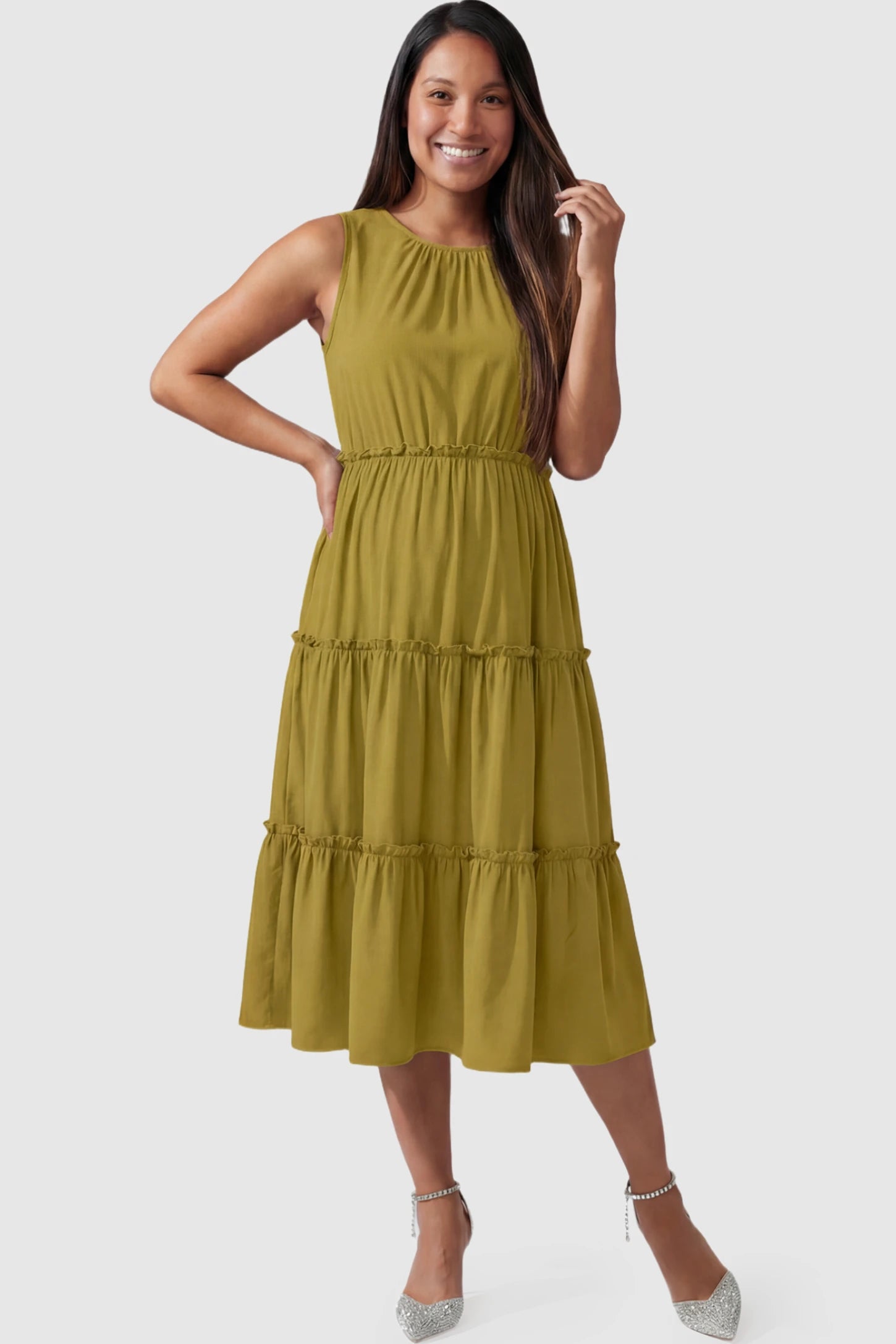 Solid Sleeveless Ruffle Tiered Maternity Midi Dress Solid Sleeveless Ruffle Tiered Maternity Midi Dress in olive green featuring a ruffle tiered skirt on a pregnant model.