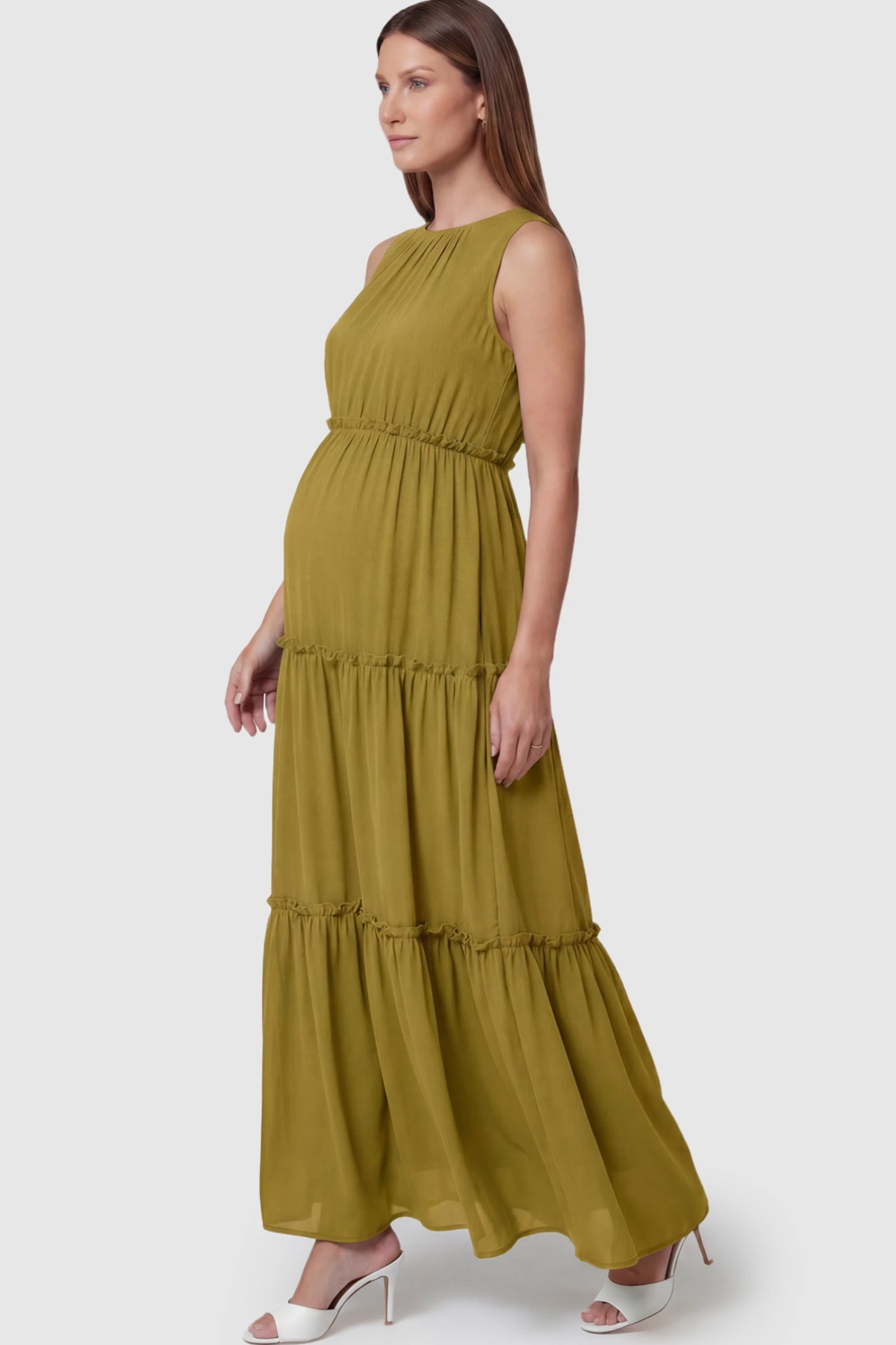 Solid Sleeveless Ruffle Tiered Maternity Midi Dress Solid Sleeveless Ruffle Tiered Maternity Midi Dress in Olive Green featuring a ruffle tiered skirt on a pregnant model.