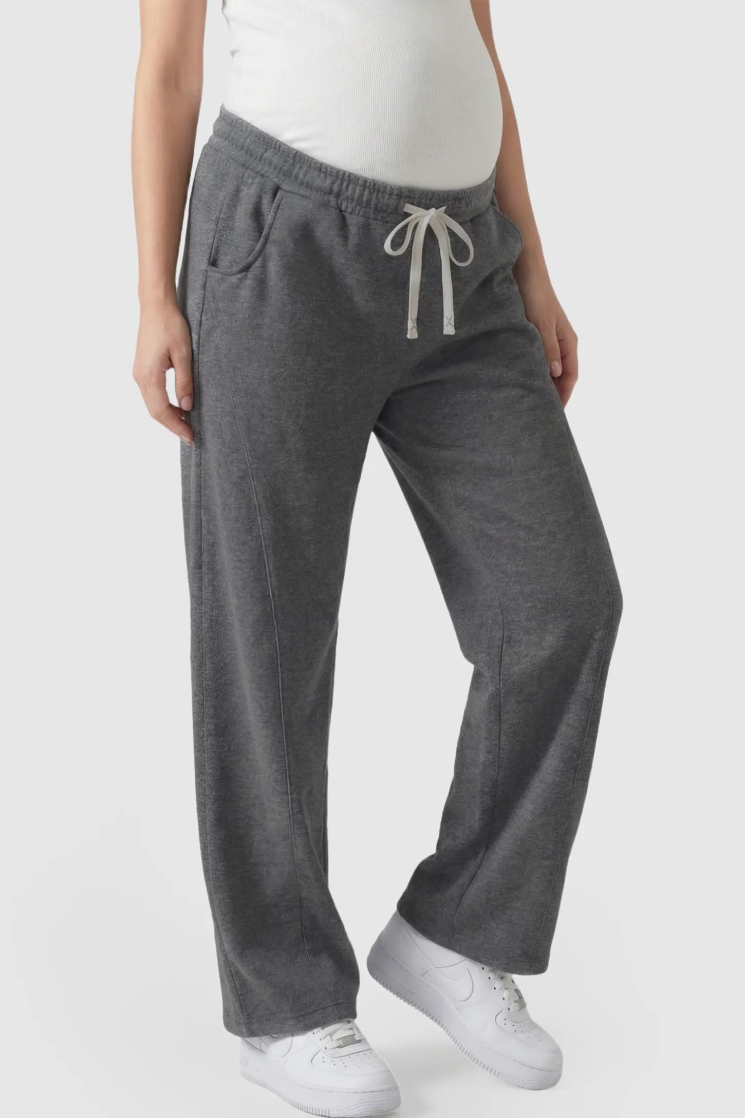 Drawstring Waist Wide Leg Maternity Lounge Pants in Dark Gray featuring diagonal seam detailing and a relaxed silhouette on a pregnant model.