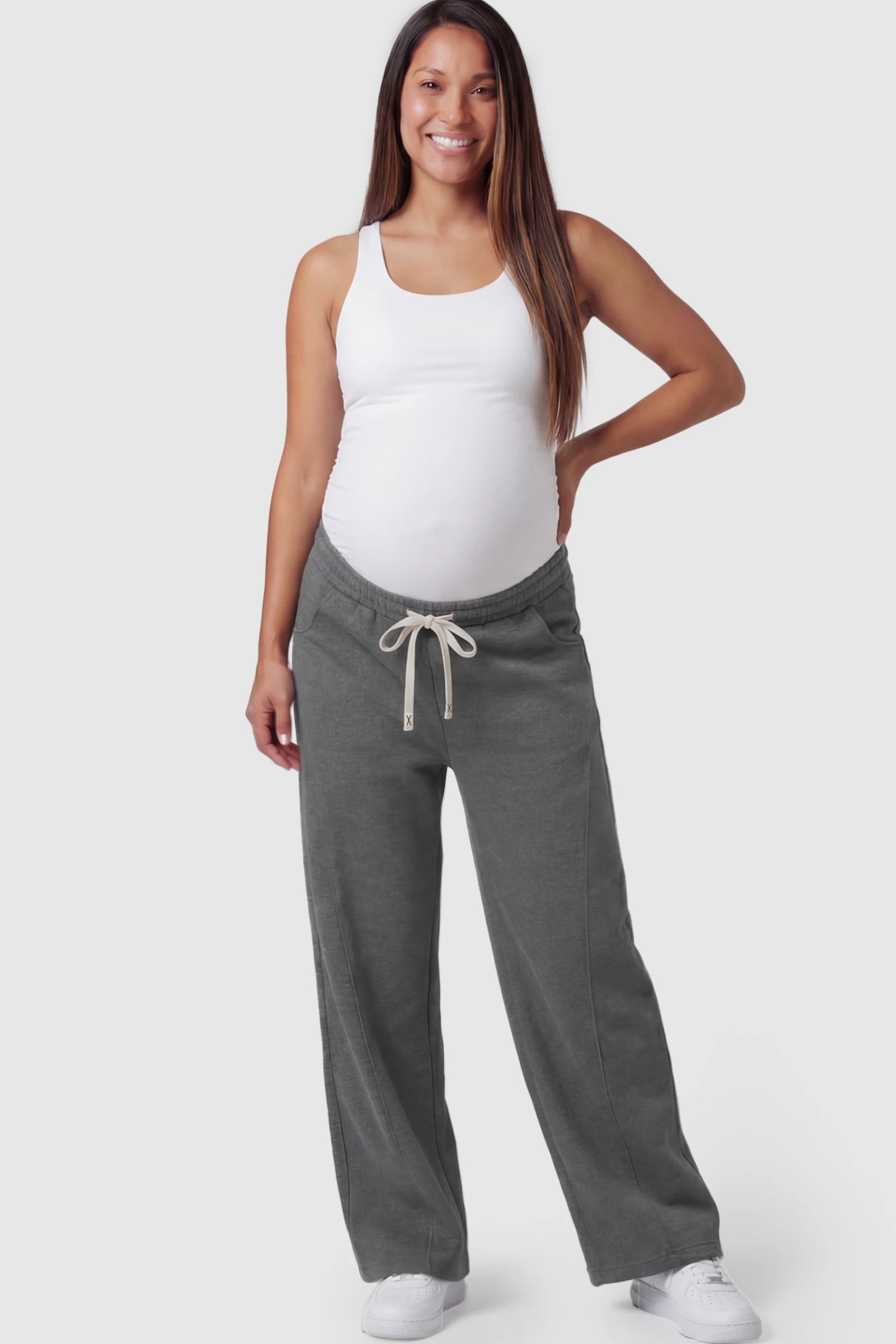 Drawstring Waist Wide Leg Maternity Lounge Pants in Dark Gray featuring diagonal seam detailing and a relaxed silhouette on a pregnant model.