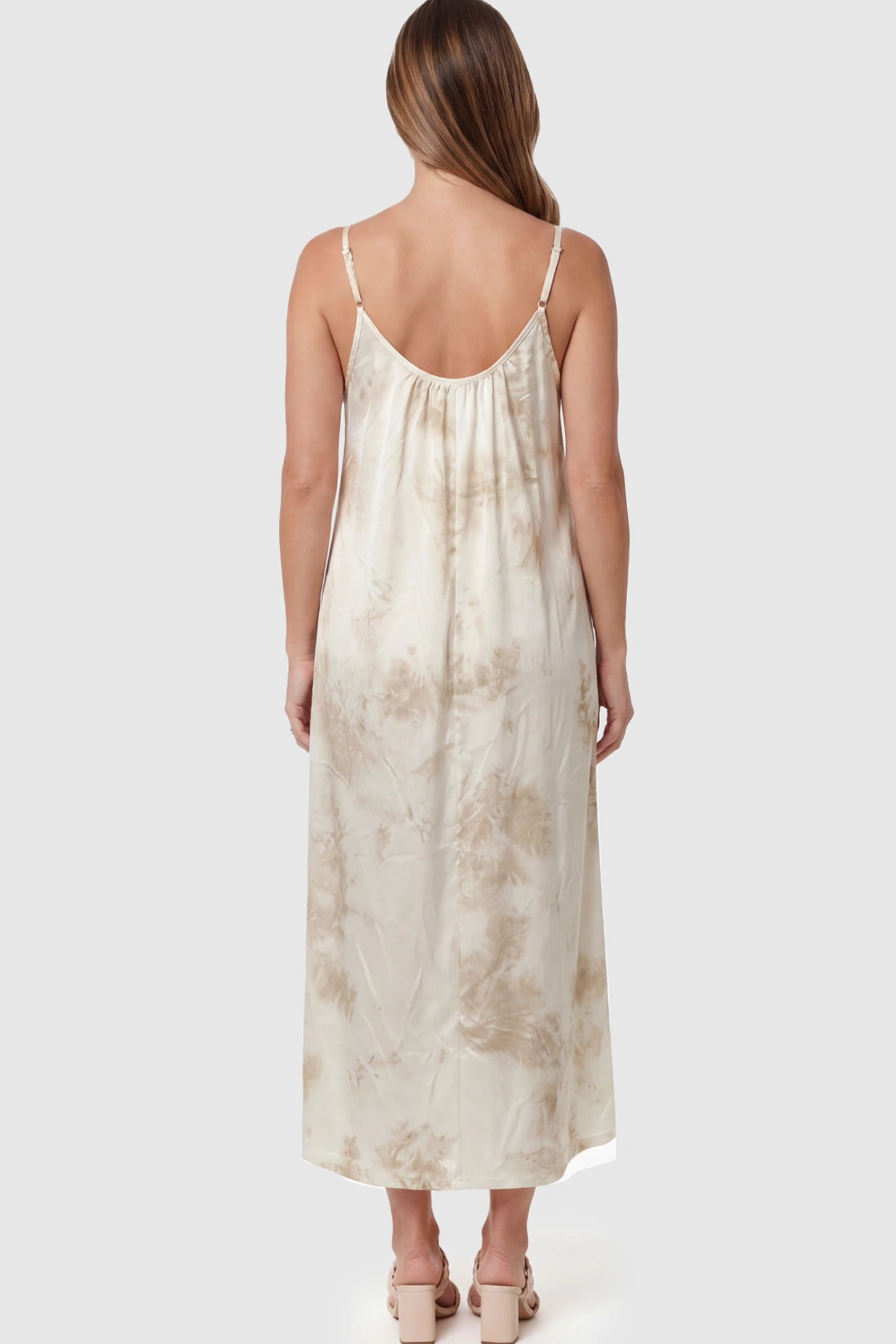 Tie-Dye Print Spaghetti Strap Maternity Maxi Dress Tie-Dye Print Spaghetti Strap Maternity Maxi Dress in Cream and White on a pregnant model.