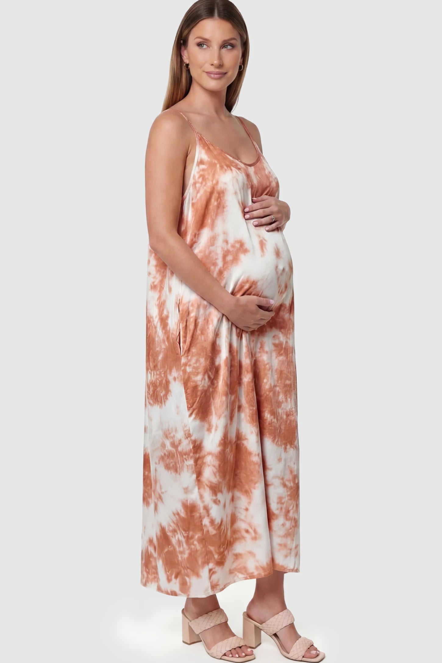 Tie-Dye Print Spaghetti Strap Maternity Maxi Dress in Pink and White featuring side pockets on a pregnant model.