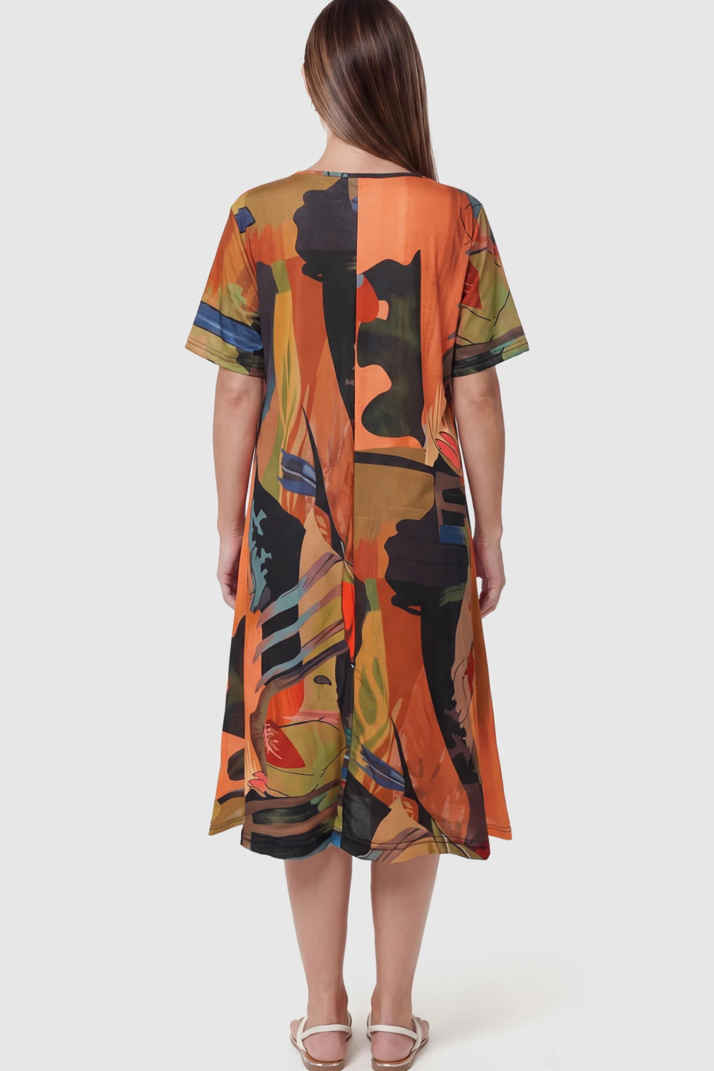 Abstract Print Scoop Neck Maternity Midi Dress Abstract Print Scoop Neck Maternity Midi Dress in vibrant orange featuring a flowy A-line silhouette on a pregnant model.