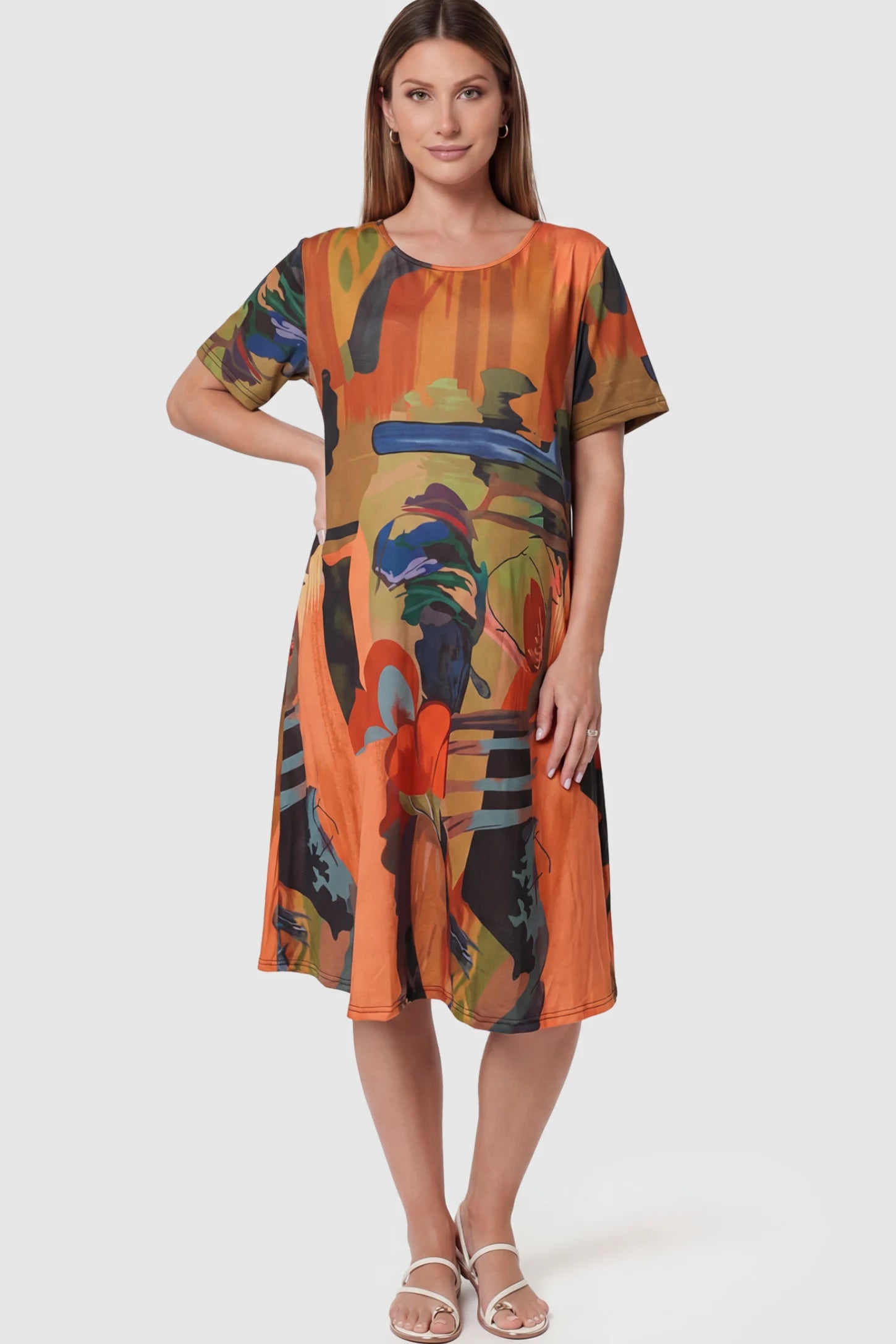 Abstract Print Scoop Neck Maternity Midi Dress in vibrant orange featuring a flowy A-line silhouette on a pregnant model.
