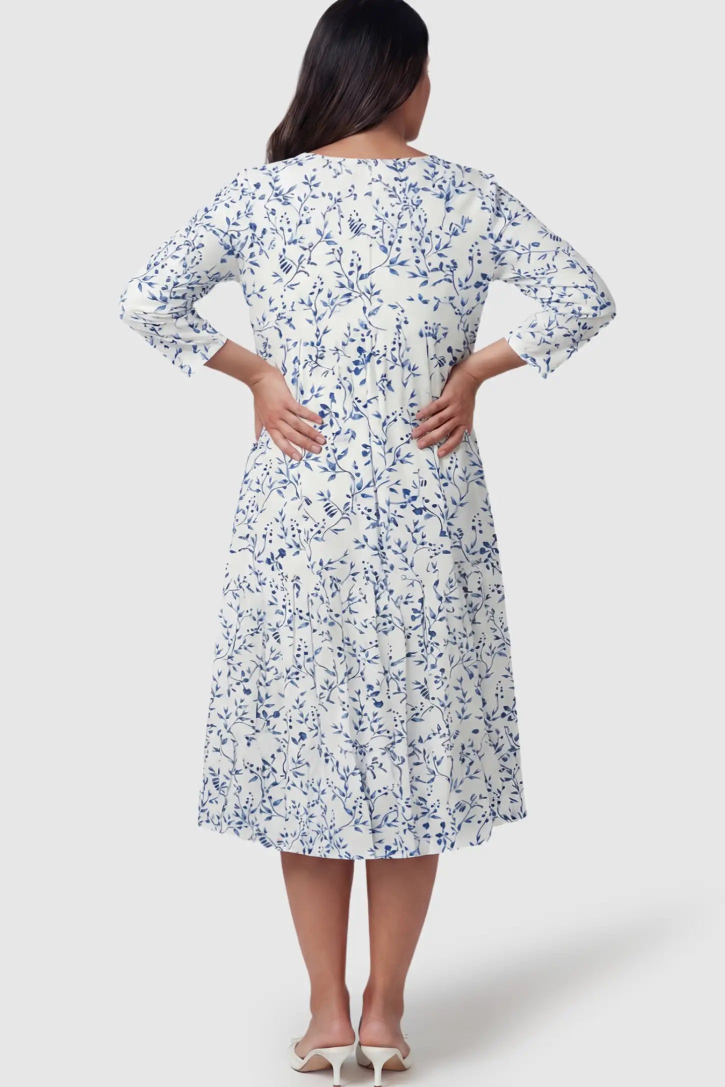 Floral Scoop Neck Tiered Maternity Midi Dress Floral Scoop Neck Tiered Midi Maternity Dress in Blue featuring a sweet tiered skirt on a pregnant model.