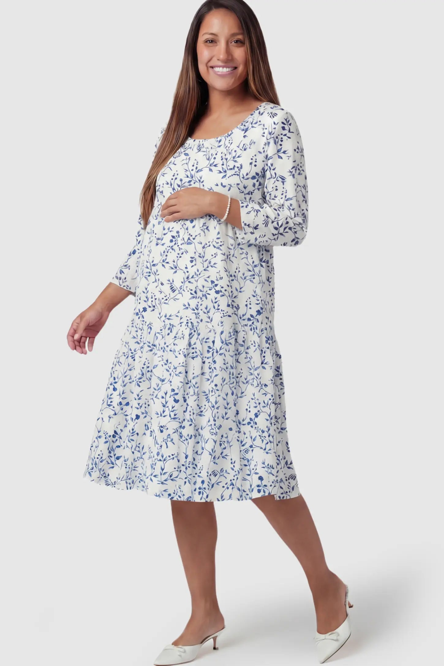 Floral Scoop Neck Tiered Midi Maternity Dress in Blue featuring a sweet tiered skirt on a pregnant model.
