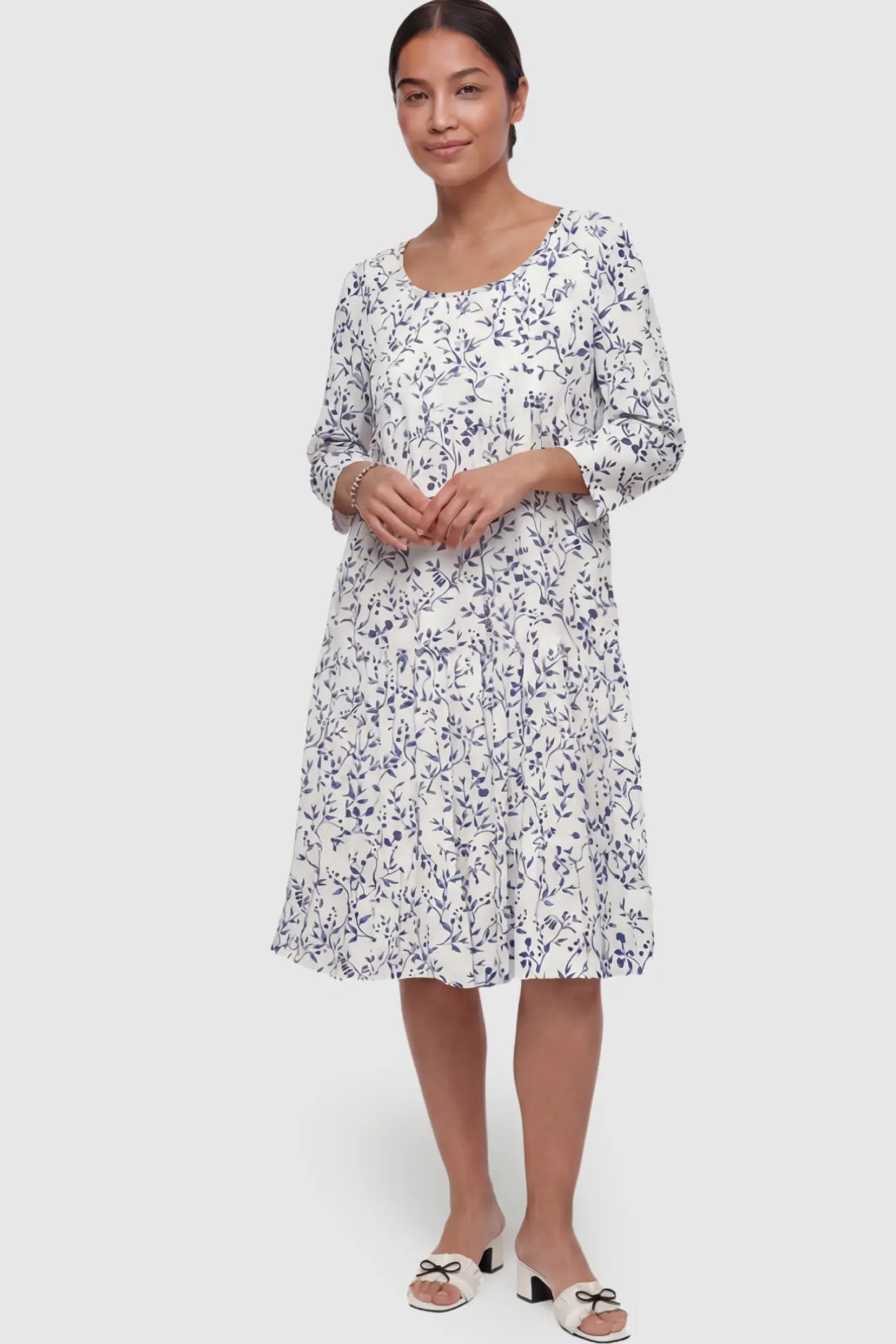 Floral Scoop Neck Tiered Maternity Midi Dress Floral Scoop Neck Tiered Midi Maternity Dress in Blue featuring a sweet tiered skirt on a postpartum model.