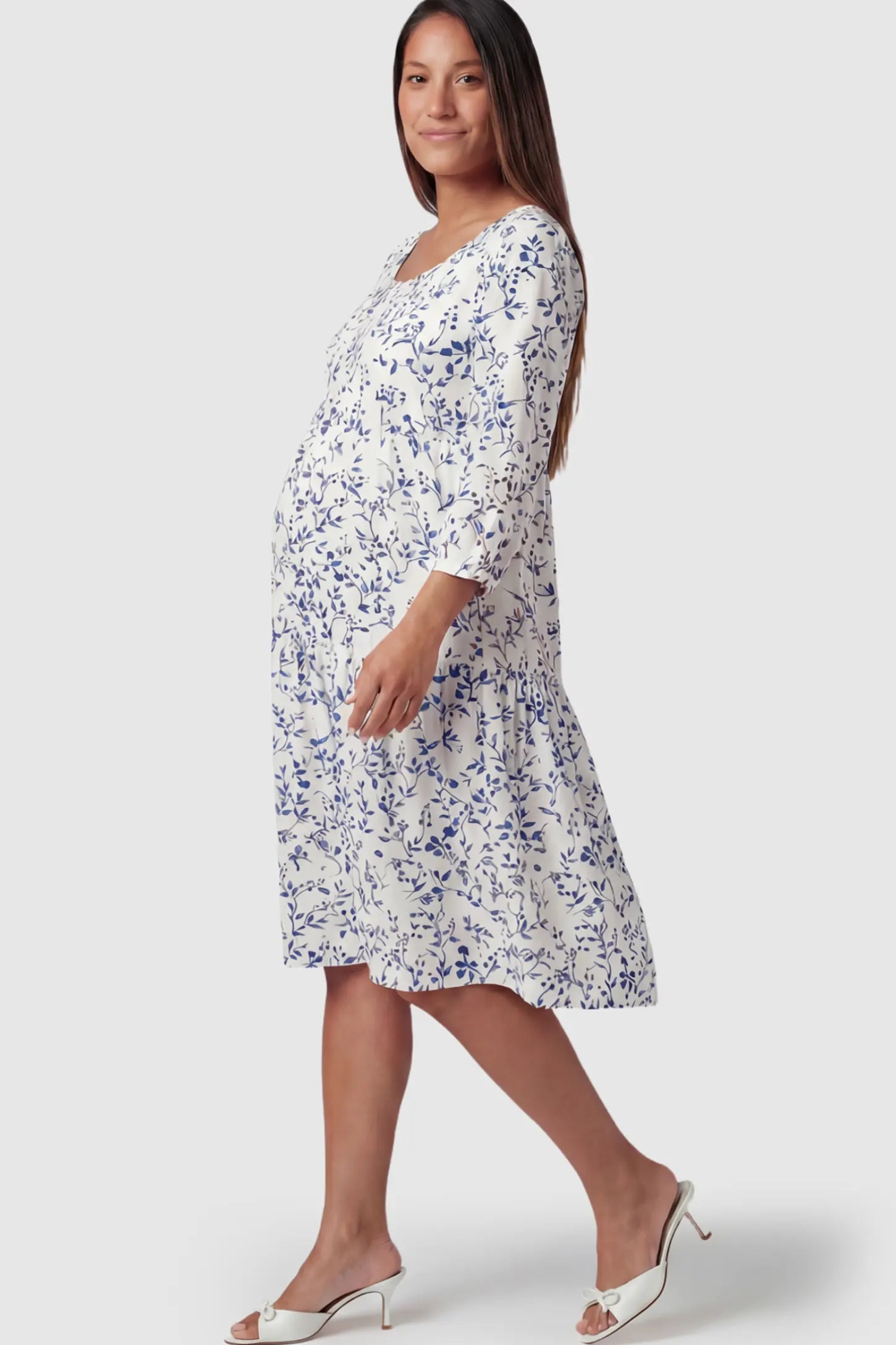 Floral Scoop Neck Tiered Midi Maternity Dress in Blue featuring a sweet tiered skirt on a pregnant model.