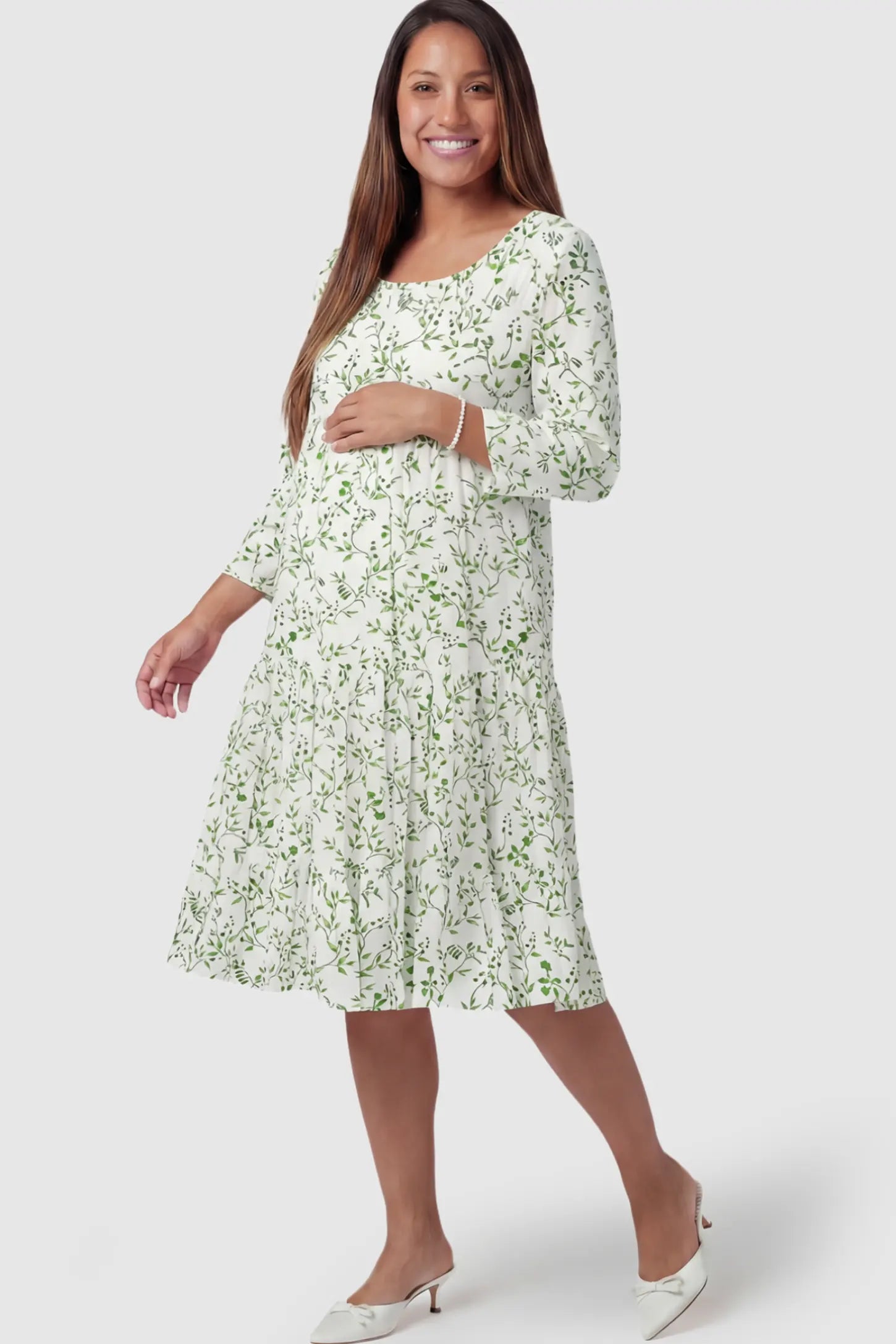 Floral Scoop Neck Tiered Maternity Midi Dress Floral Scoop Neck Tiered Midi Maternity Dress in Green featuring a sweet tiered skirt on a pregnant model.