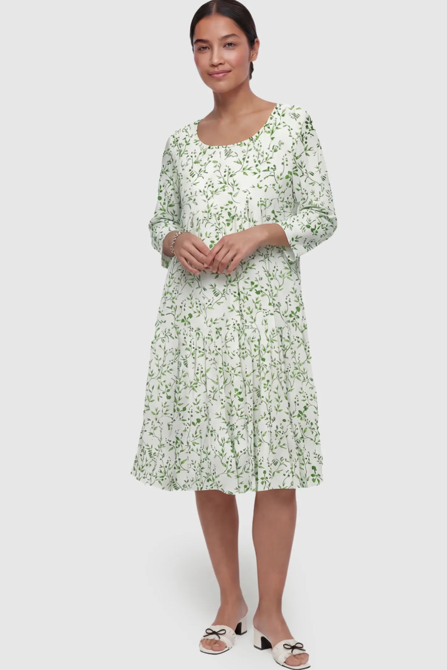 Floral Scoop Neck Tiered Maternity Midi Dress Floral Scoop Neck Tiered Midi Maternity Dress in Green featuring a sweet tiered skirt on a postpartum model.