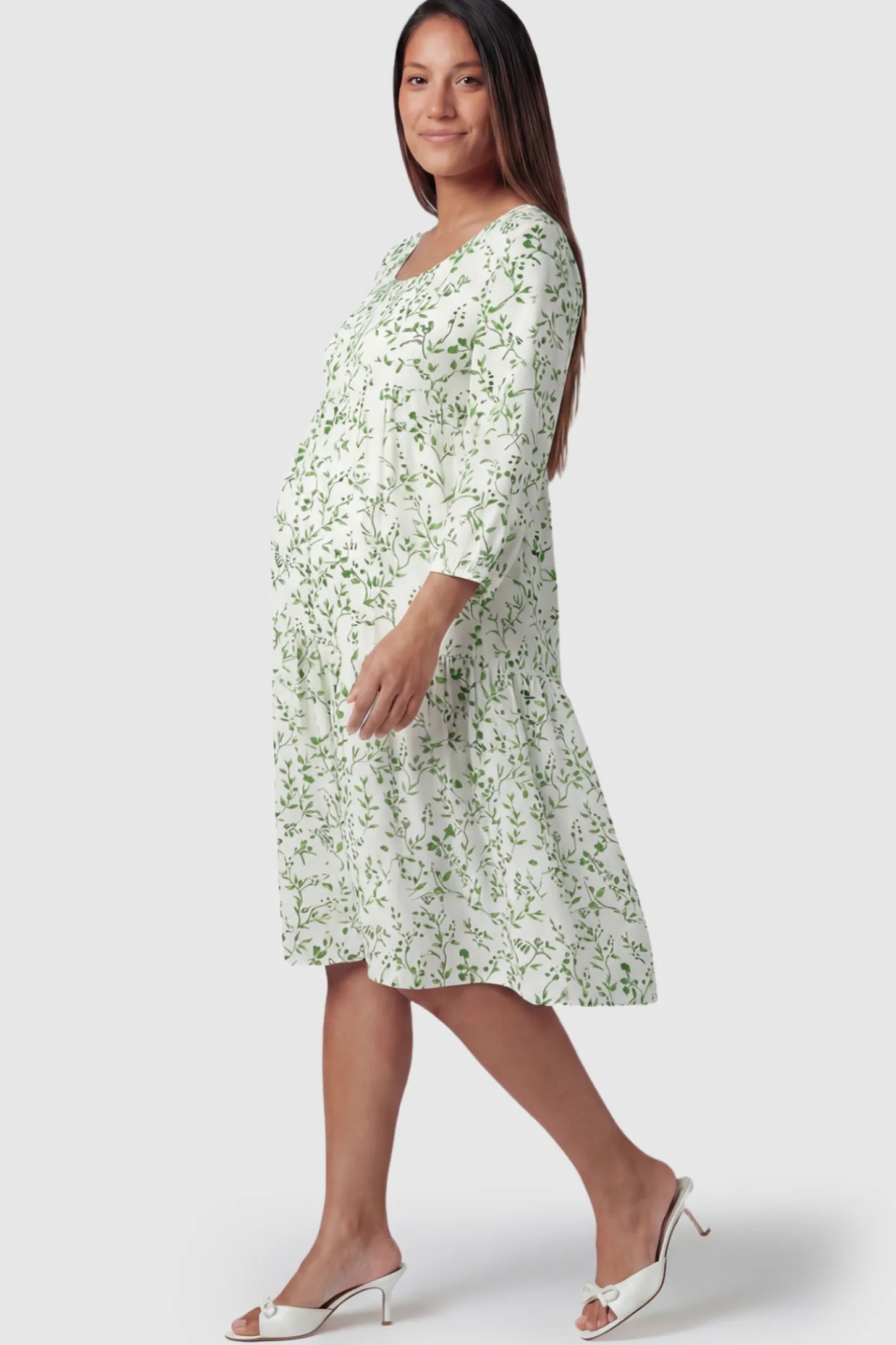 Floral Scoop Neck Tiered Maternity Midi Dress Floral Scoop Neck Tiered Midi Maternity Dress in Green featuring a sweet tiered skirt on a pregnant model.