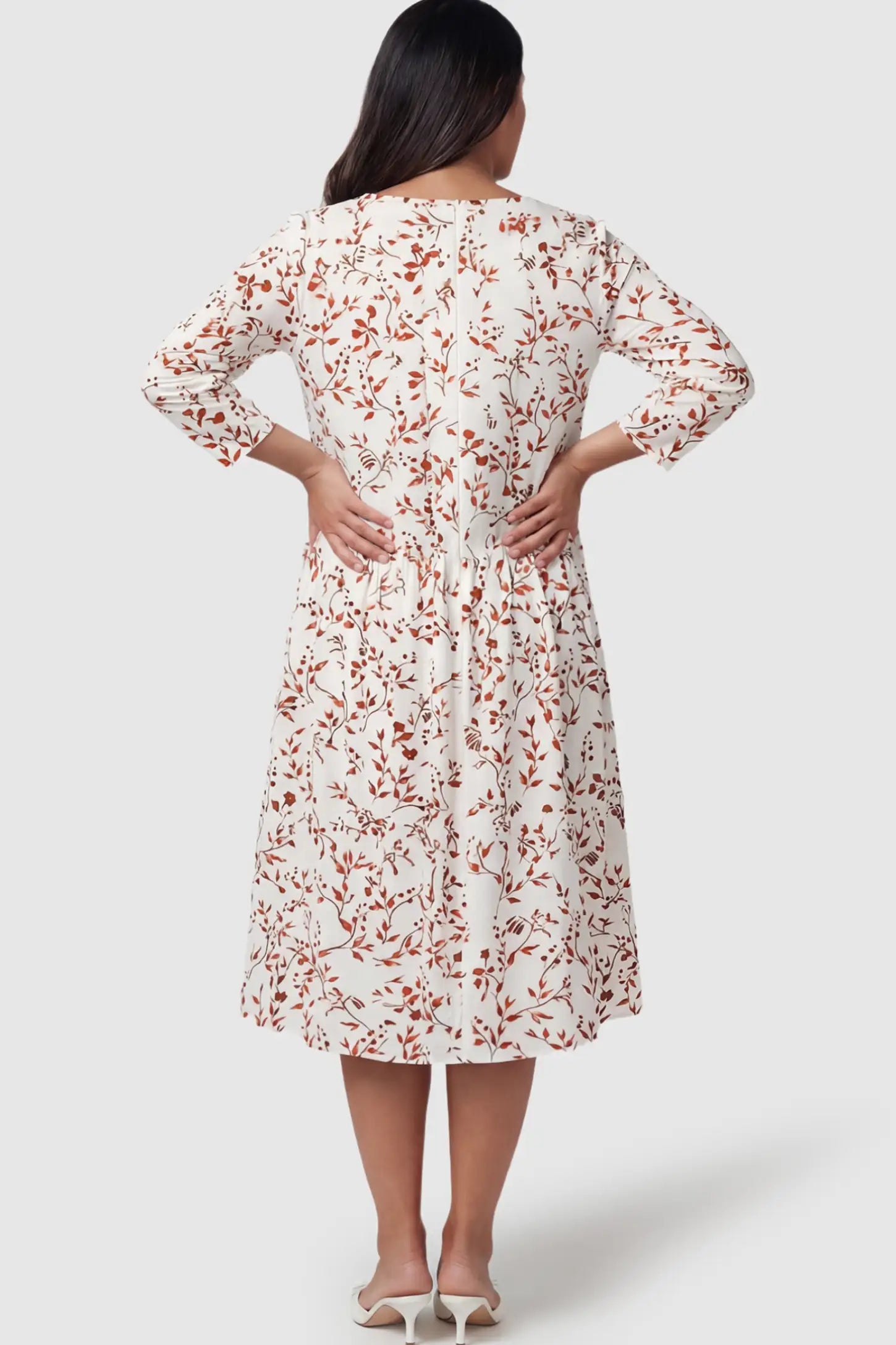 Floral Scoop Neck Tiered Maternity Midi Dress Floral Scoop Neck Tiered Midi Maternity Dress in Red featuring a sweet tiered skirt on a pregnant model.