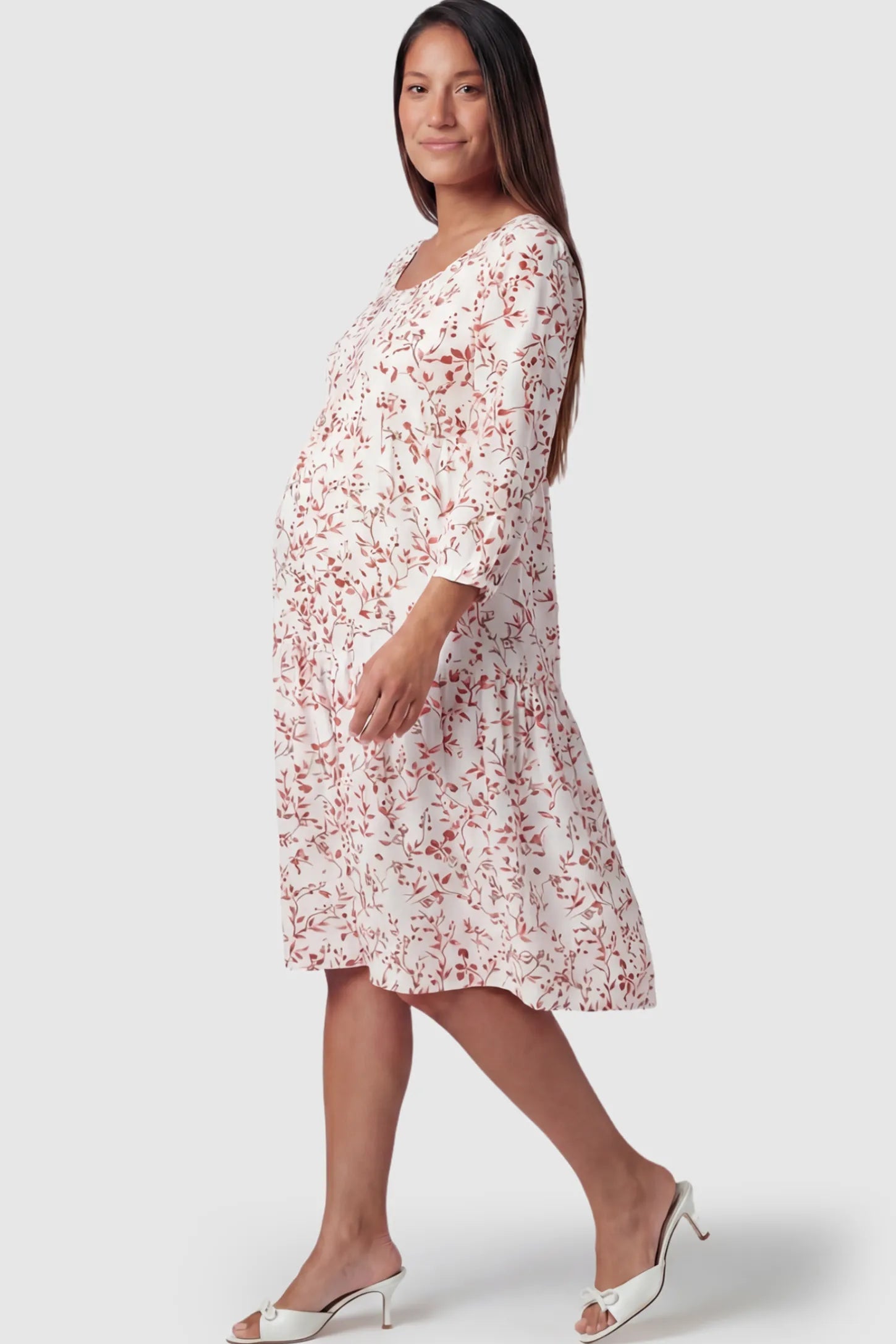 Floral Scoop Neck Tiered Maternity Midi Dress Floral Scoop Neck Tiered Midi Maternity Dress in Rose featuring a sweet tiered skirt on a pregnant model.