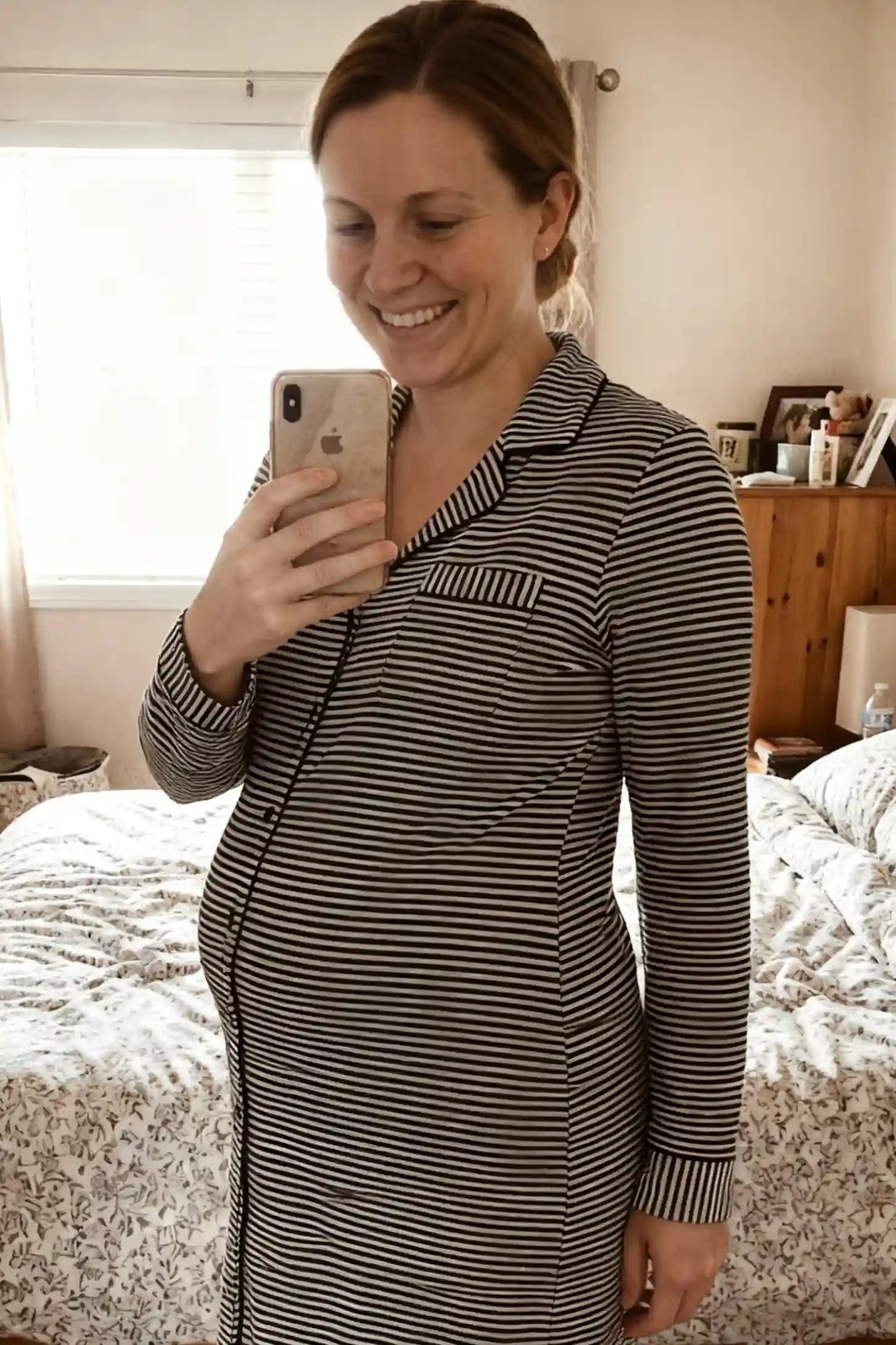 Striped Long Sleeve Button Down Maternity Nightshirt Horizontal Striped Long Sleeve Maternity Nightshirt in Navy Blue featuring a button-down front on a pregnant model.