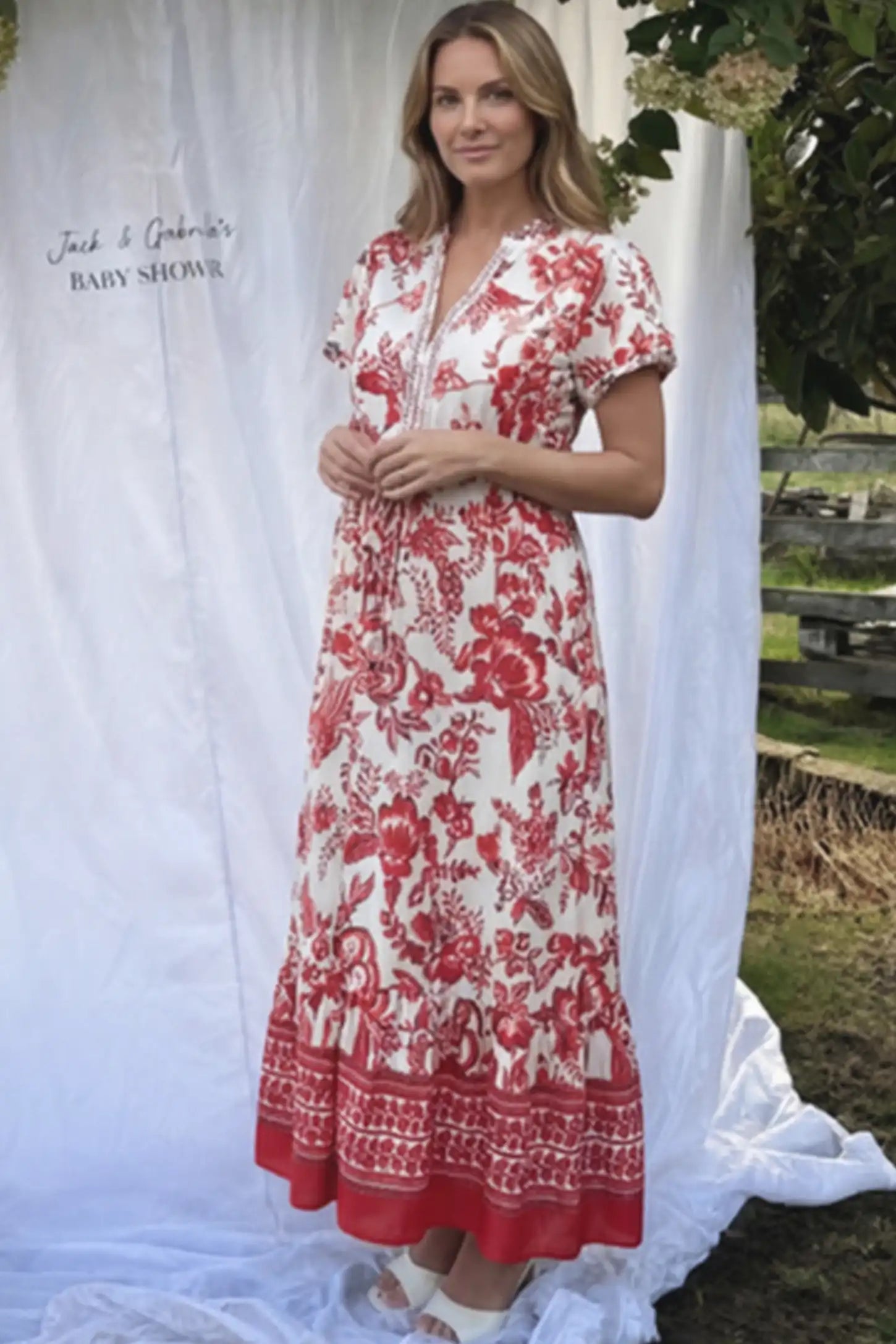 Retro Floral Print V-Neck Maternity Midi Dress Retro Floral Print V-Neck Midi Maternity Dress in red featuring a cinched drawstring waist on a pregnant woman.