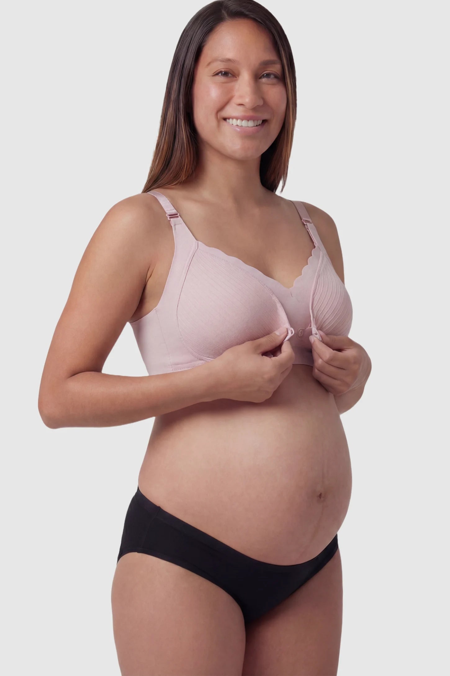 Textured Wire Free Front Snap Maternity Nursing Bra Textured Wire-Free Front-Snap Maternity Nursing Bra in Dusty Rose featuring breathable ribbed fabric on a pregnant model.