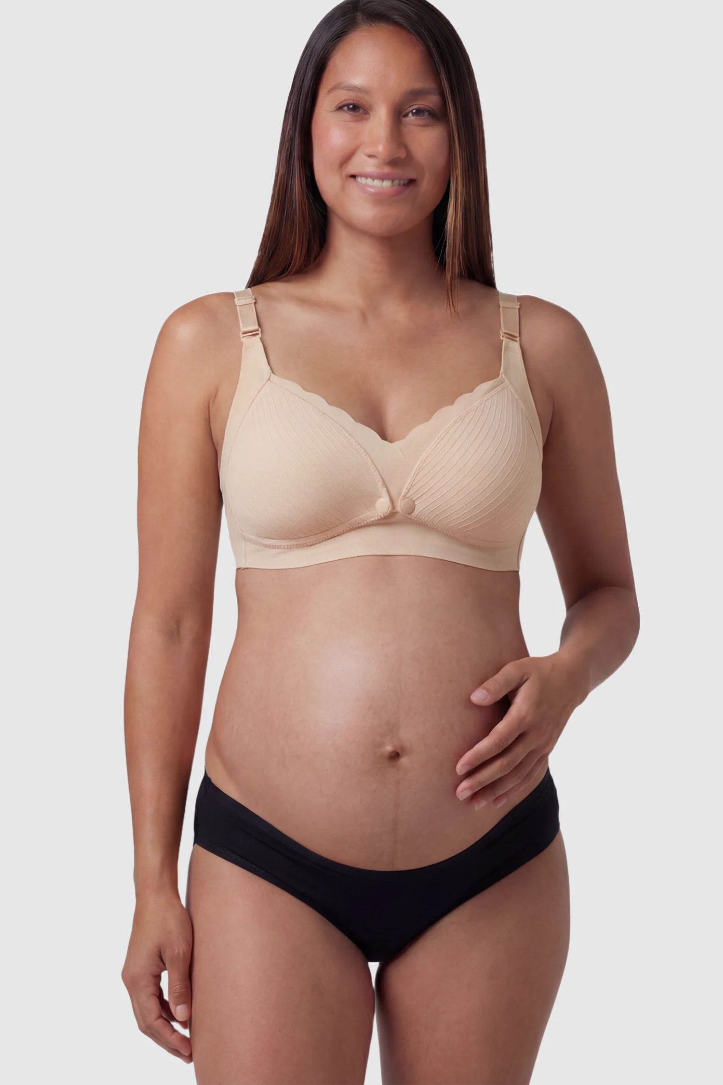 Textured Wire Free Front Snap Maternity Nursing Bra Textured Wire-Free Front-Snap Maternity Nursing Bra in Skin Tone featuring breathable ribbed fabric on a pregnant model.