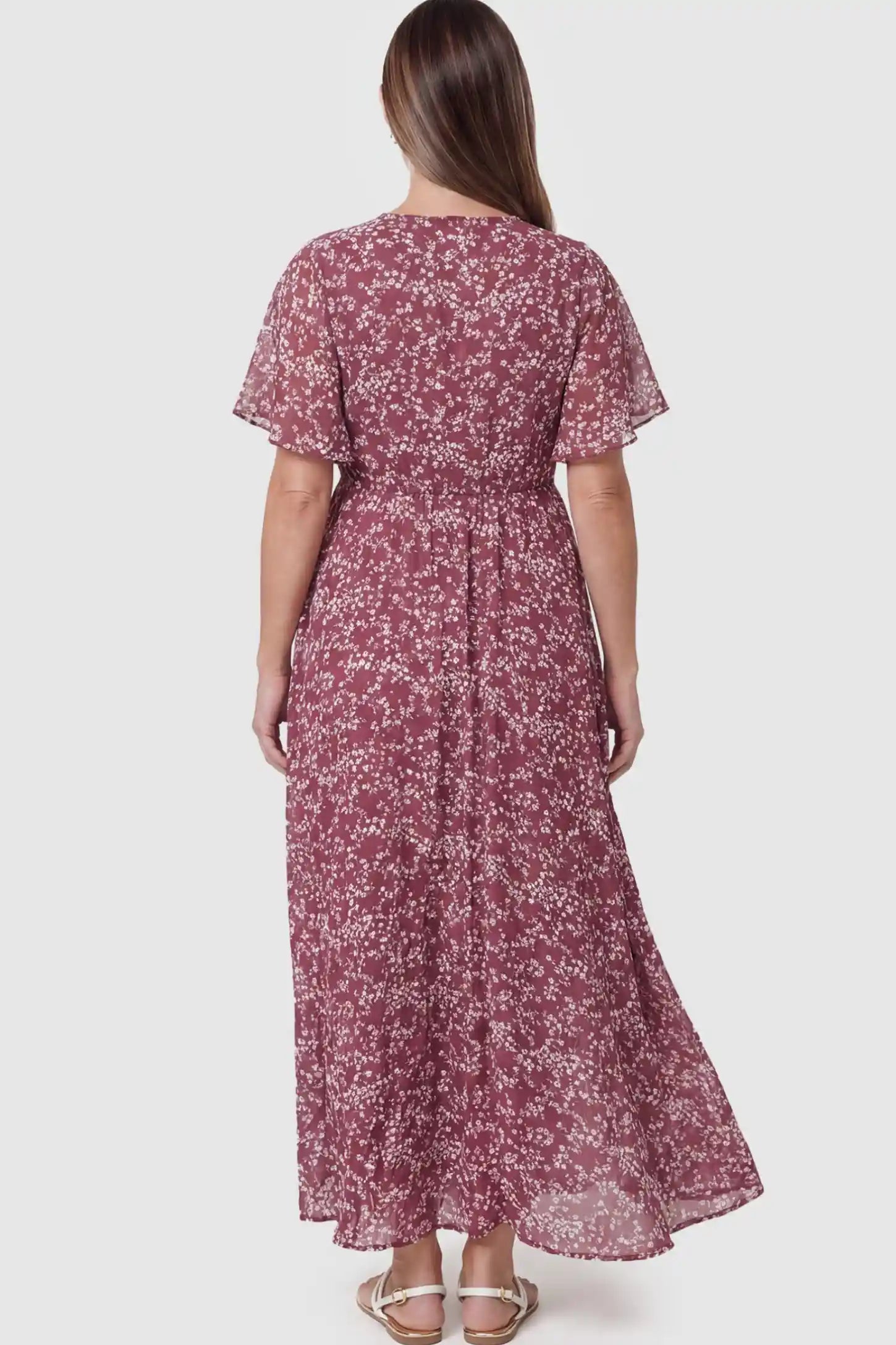 Floral V-Neck Side-Slit Maternity Maxi Dress Floral V-Neck Side-Slit Maternity Maxi Dress in pink on a pregnant model.