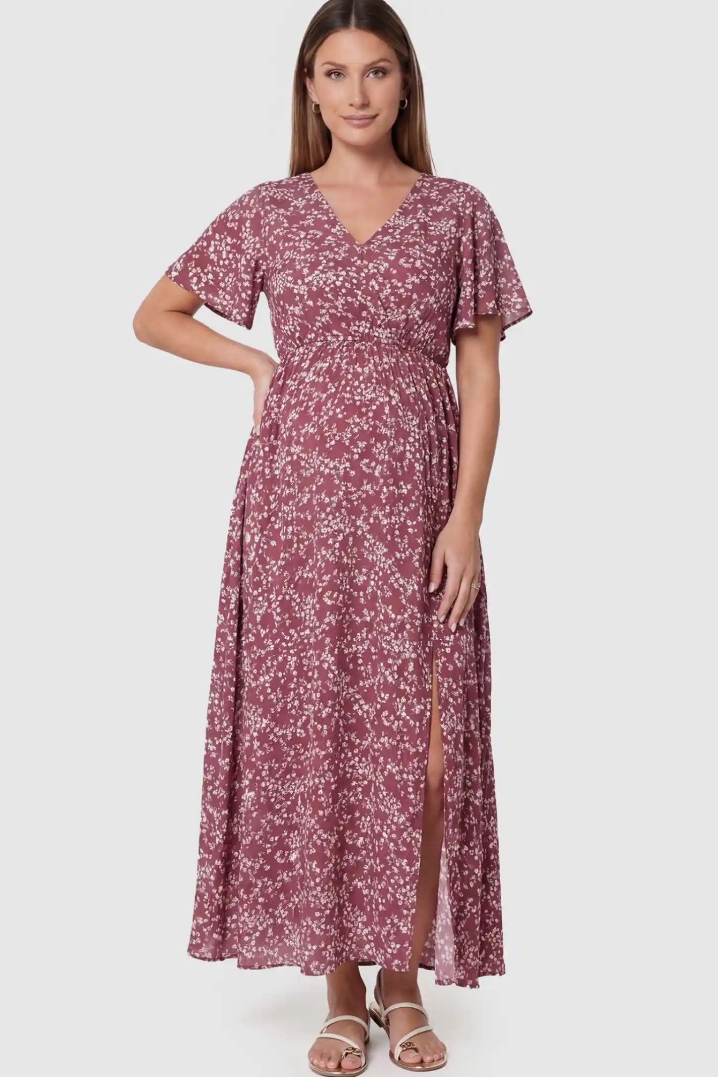Floral V-Neck Side-Slit Maternity Maxi Dress Floral V-Neck Side-Slit Maternity Maxi Dress in pink on a pregnant model.