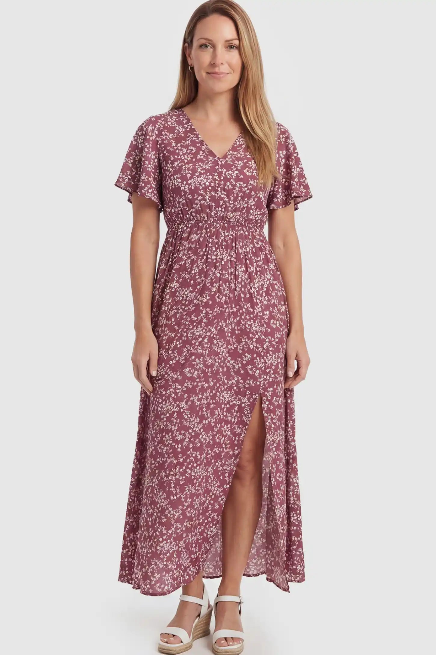 Floral V-Neck Side-Slit Maternity Maxi Dress Floral V-Neck Side-Slit Maternity Maxi Dress in pink on a postpartum model.