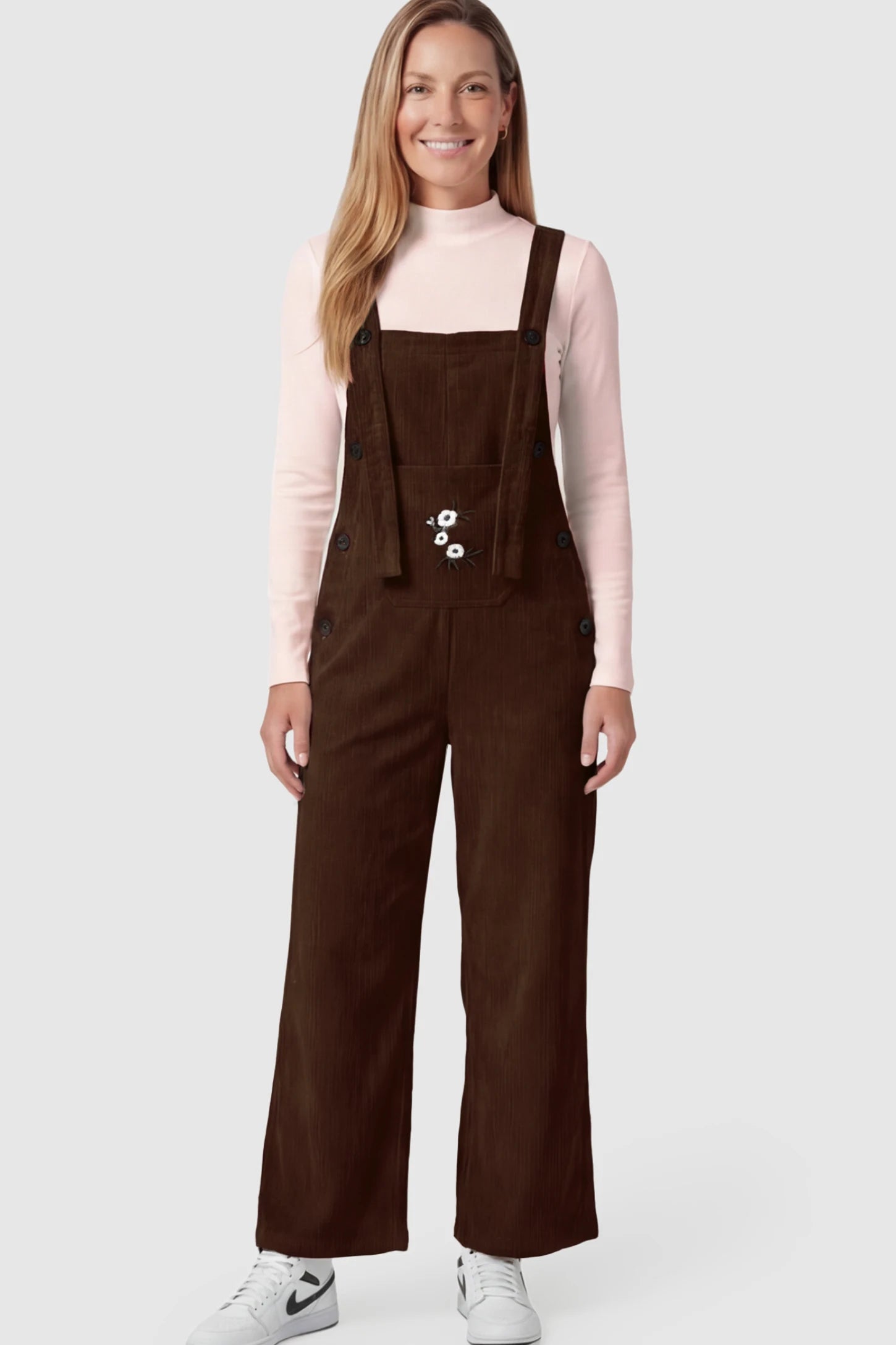 Adjustable Strap Wide-Leg Corduroy Maternity Overalls Floral Embroidered Wide-Leg Maternity Overalls in Brown with adjustable straps on a postpartum model.