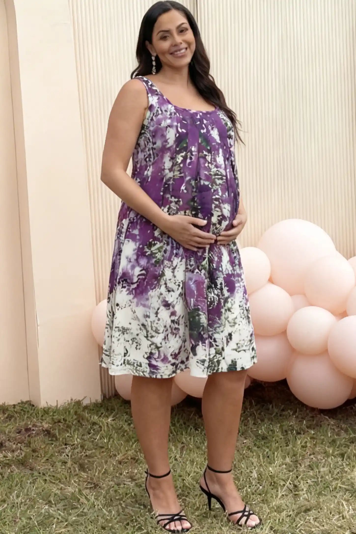 Floral Print Scoop Neck Pleated Maternity Short Dress in purple abstract print on a pregnant model.