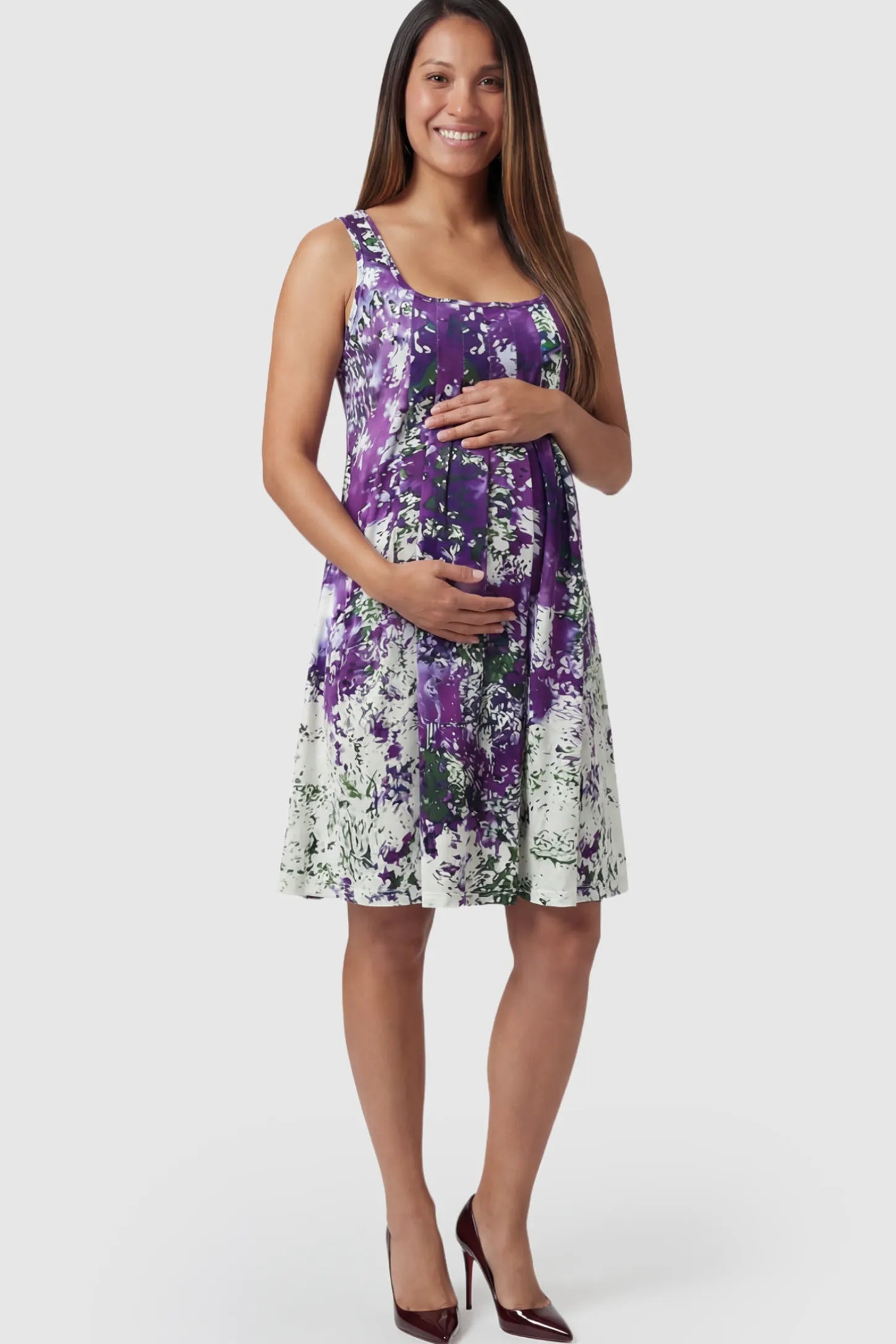 Floral Print Scoop Neck Pleated Maternity Short Dress in purple abstract print on a pregnant model.