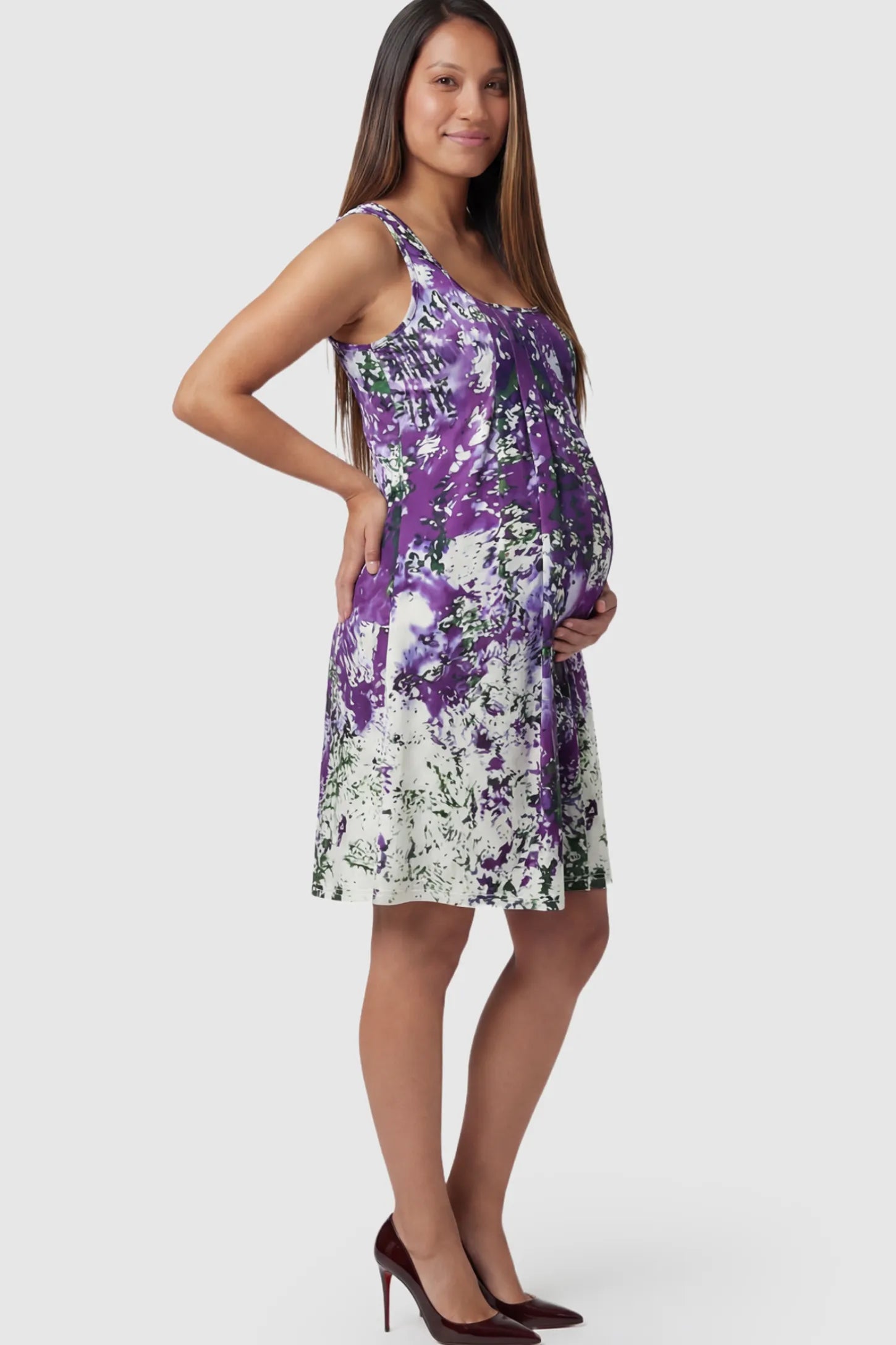Floral Print Scoop Neck Pleated Maternity Short Dress in purple abstract print on a pregnant model.