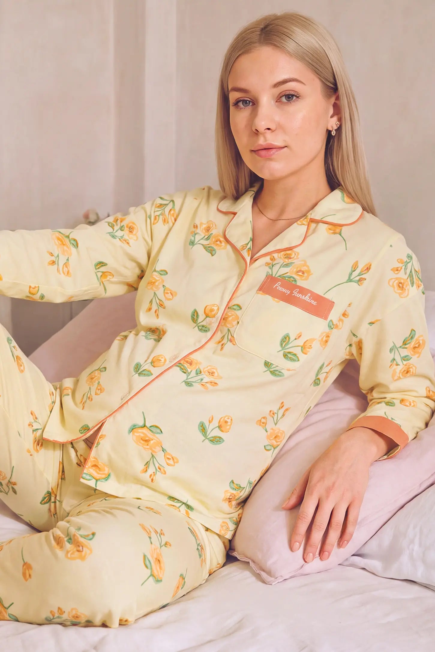 Peony Floral Organic Cotton Nursing PJ Set Peony Floral Organic Cotton Nursing PJ Set in Vintage Peony featuring soft stretch organic cotton material, classic lapel collar, and cozy loungewear fit on a pregnant model, reclining view.