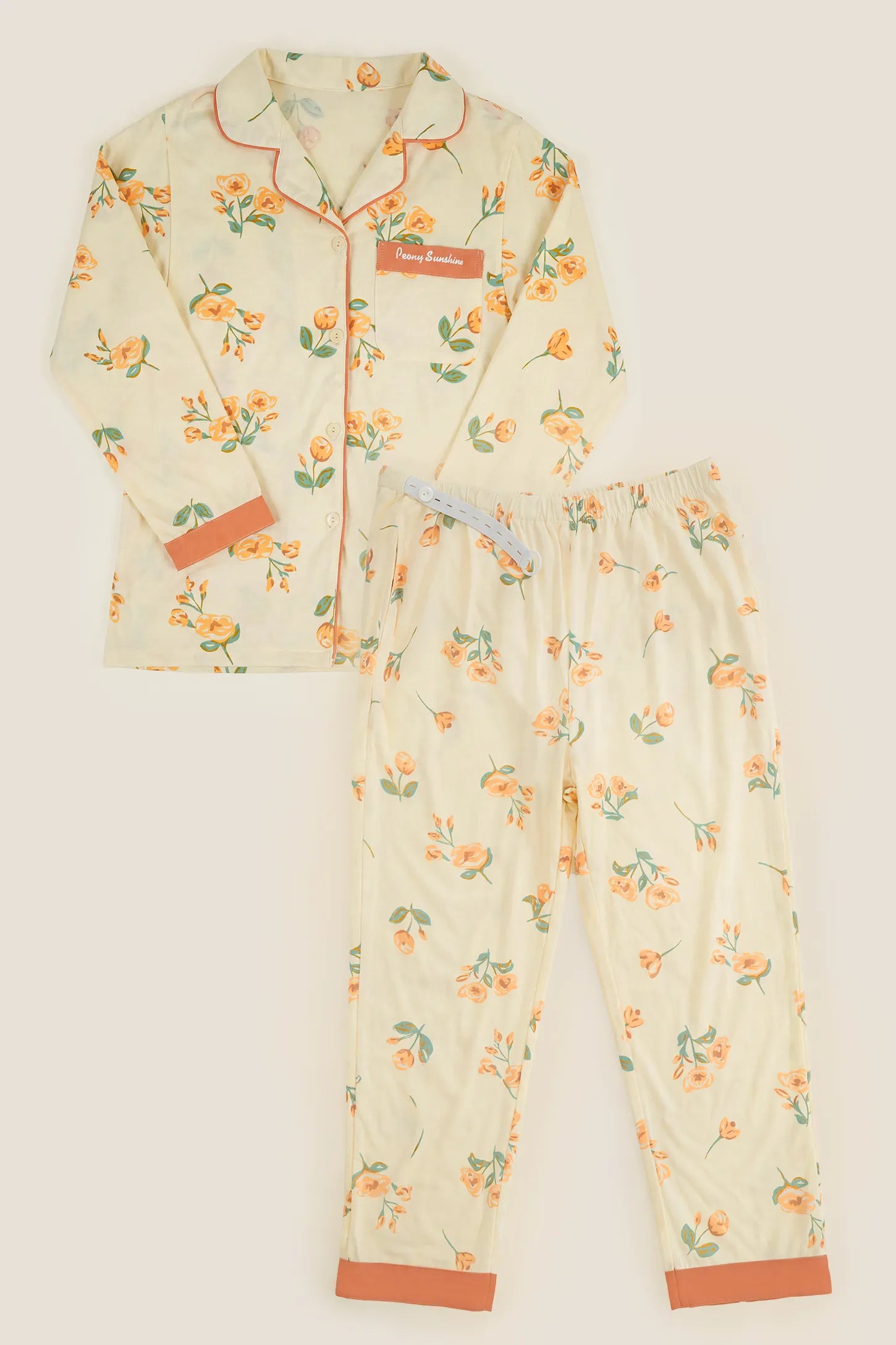 Peony Floral Organic Cotton Nursing PJ Set Peony Floral Organic Cotton Nursing PJ Set in Vintage Peony featuring button-down long sleeve top, side pockets, and elastic waist pants with adjustable tabs, complete two-piece set flat lay view.