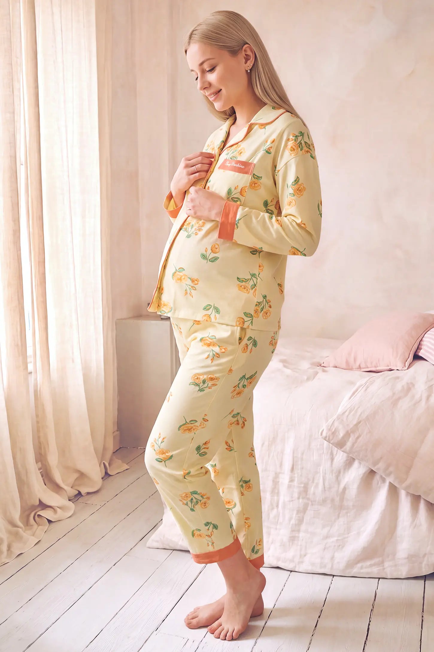 Peony Floral Organic Cotton Nursing PJ Set in Vintage Peony featuring accommodating belly stretch design, side pockets, and gentle bump support on a pregnant model, side profile view.