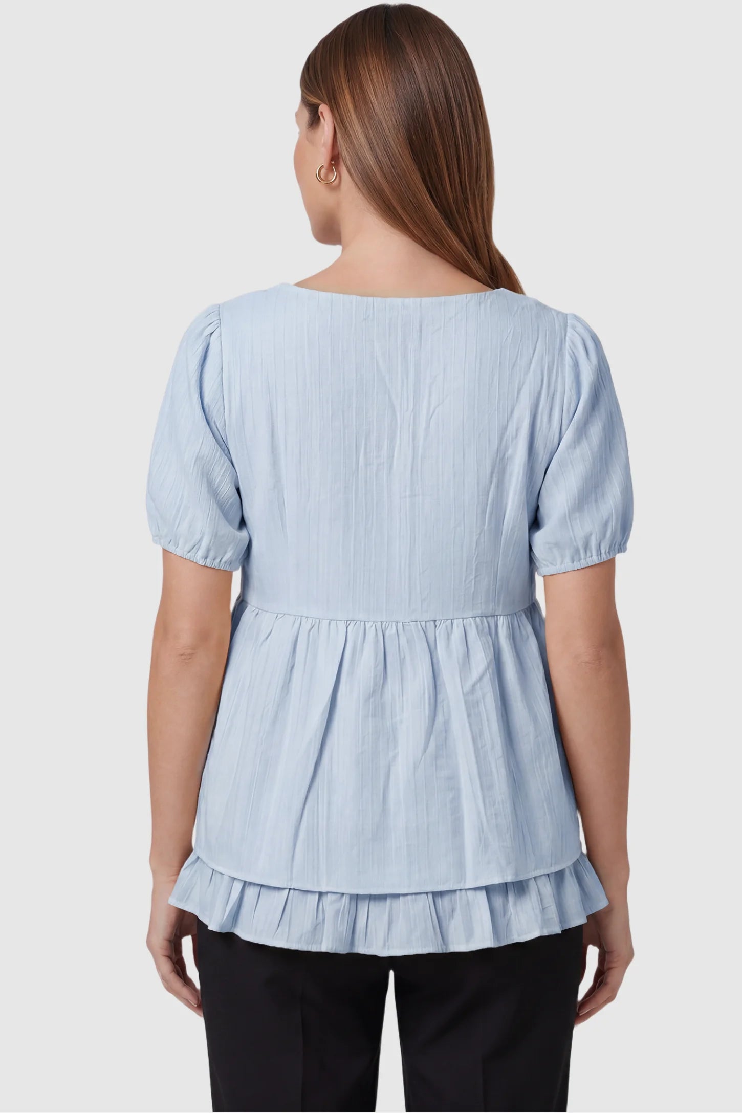 Drawstring V-Neck Peplum Maternity Top Drawstring V-neck peplum maternity top in blue with short puff sleeves, back view on pregnant model
