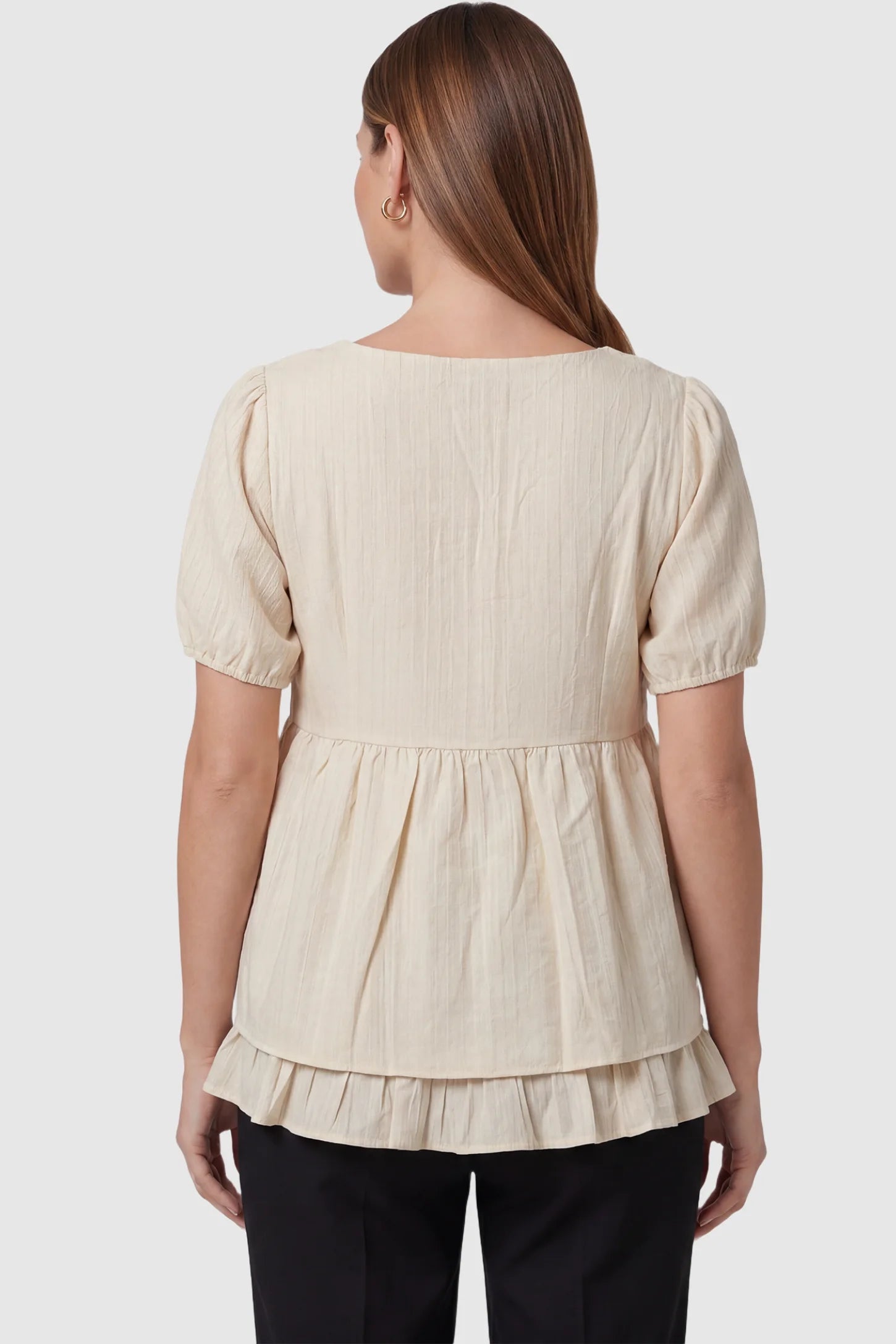 Drawstring V-Neck Peplum Maternity Top Drawstring V-neck peplum maternity top in cream with short puff sleeves, back view on pregnant model