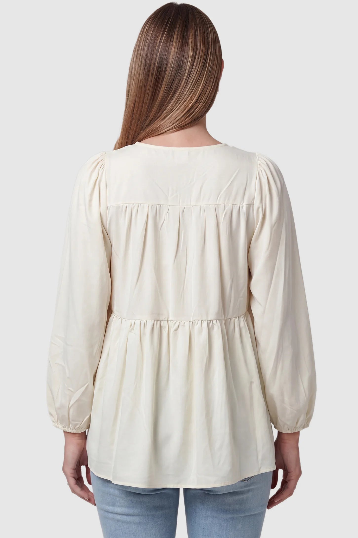 Tie-Front Tassel Long Sleeve Peplum Maternity Blouse Tie-front tassel long sleeve peplum maternity blouse in pale yellow with long sleeves, back view on pregnant model