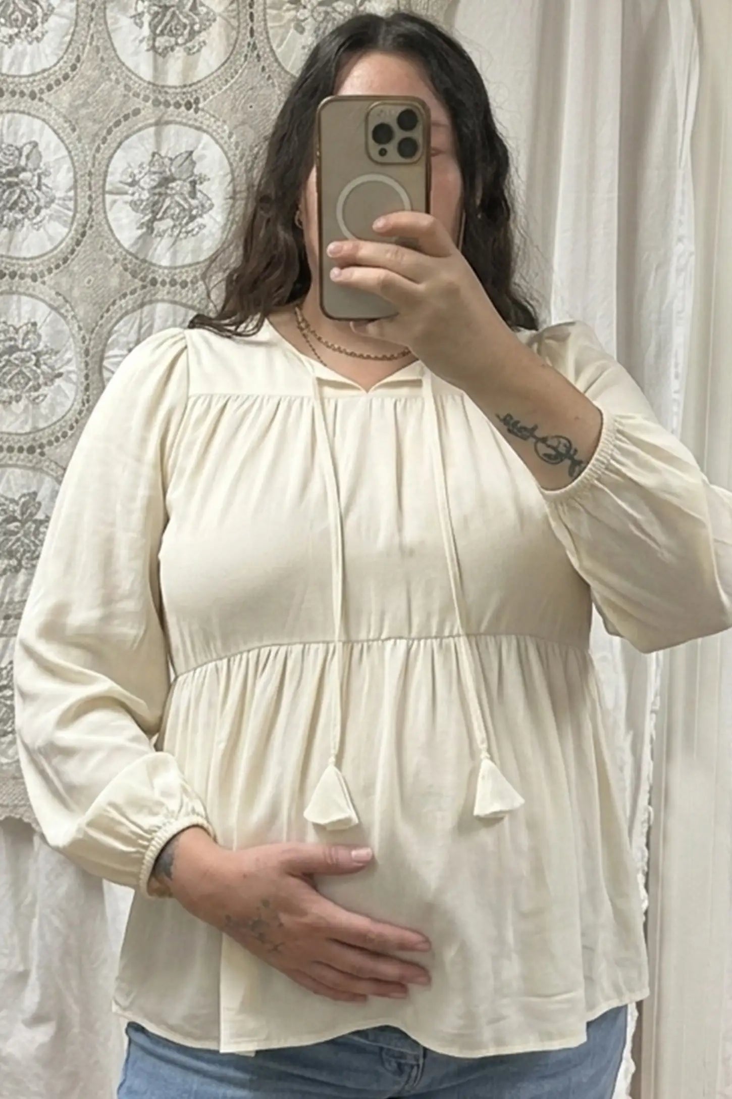 Tie-Front Tassel Long Sleeve Peplum Maternity Blouse Tie-front tassel long sleeve peplum maternity blouse in pale yellow with tie-front tassel detail, front view on pregnant model