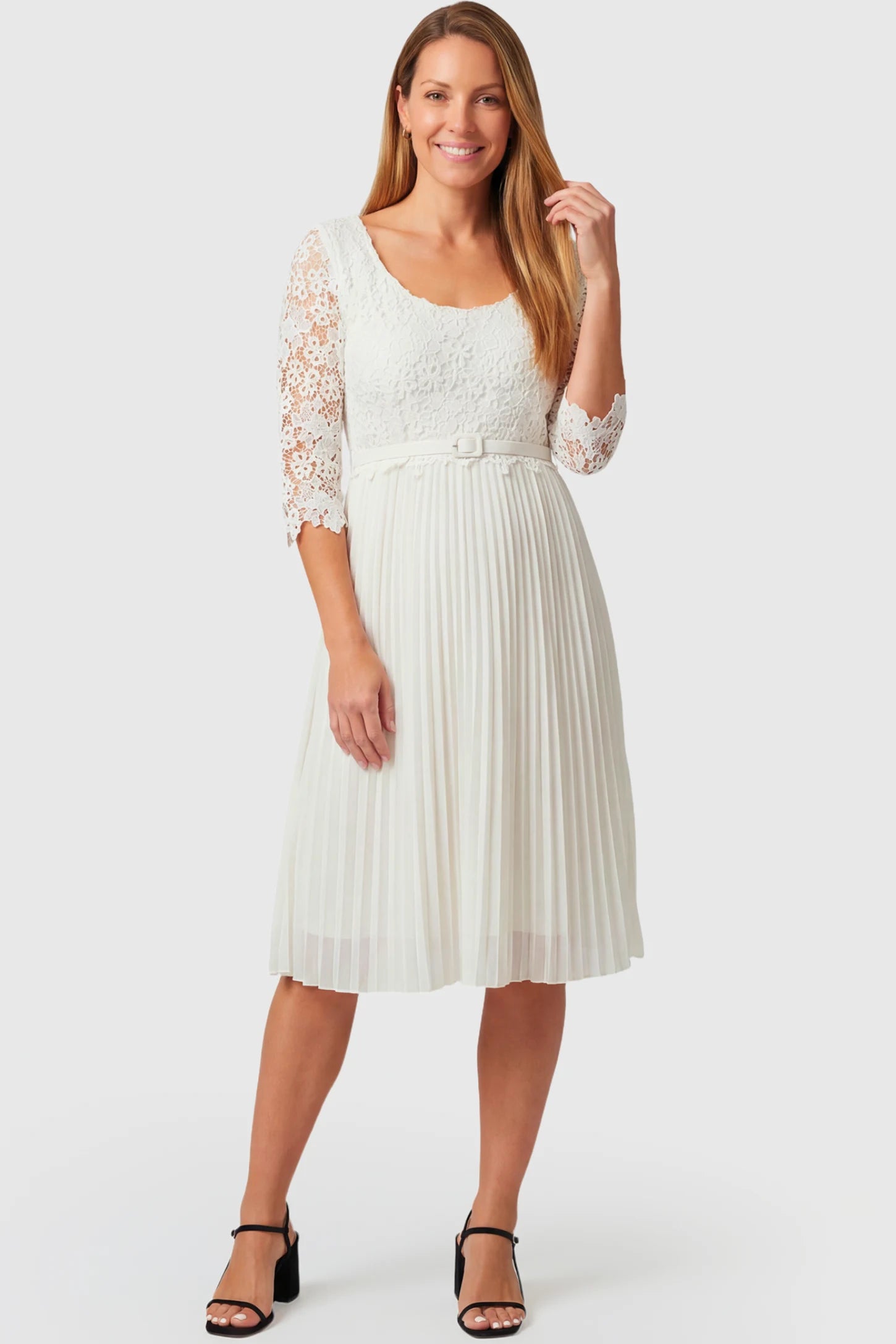Pleated 3/4 Lace Sleeve Maternity Midi Dress Pleated 3/4 Lace Sleeve Maternity Midi Dress in white featuring scoop neckline, lace sleeves, empire waist, and flowy pleated skirt on a non pregnant model.