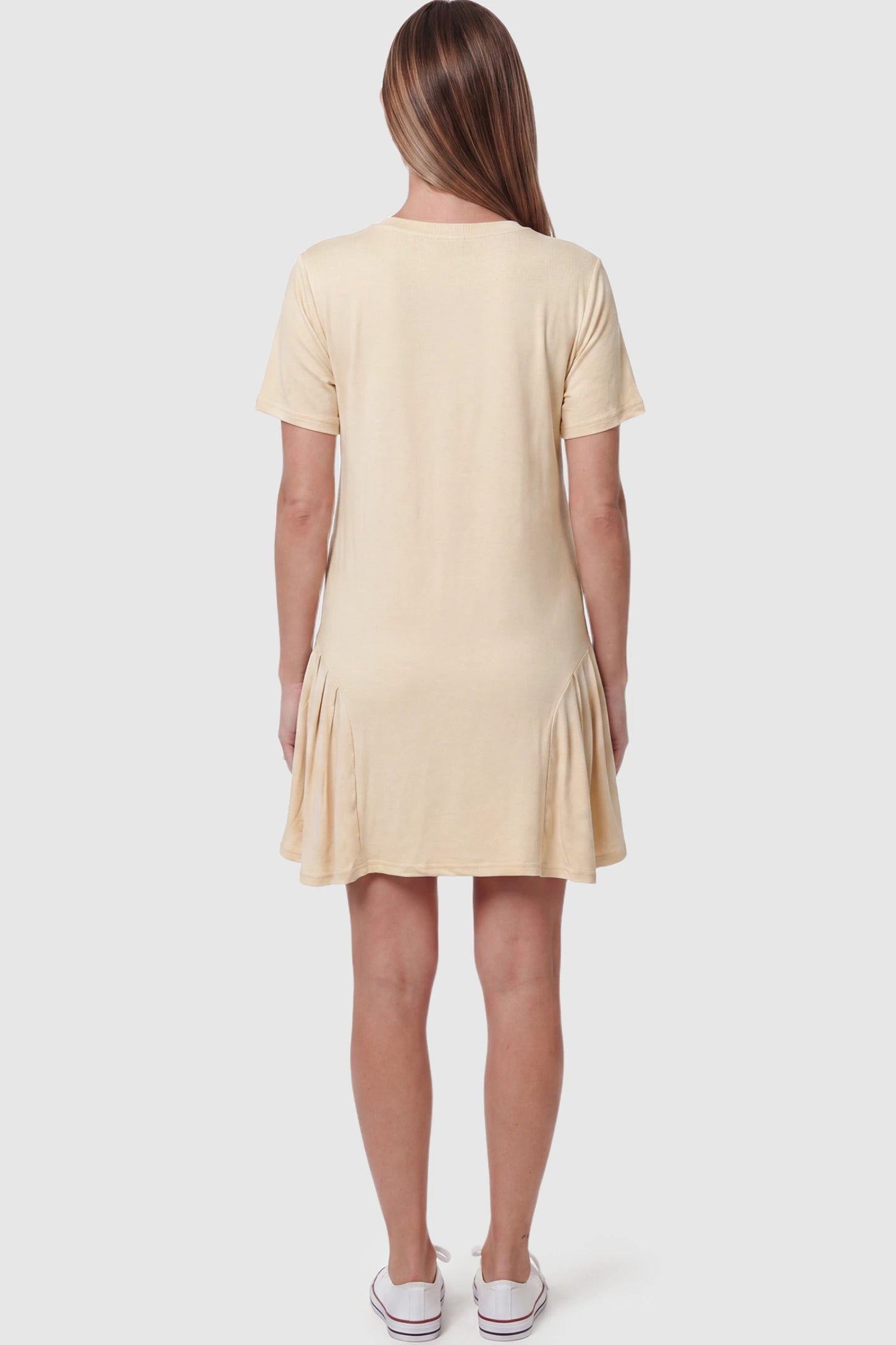 Pleated Hem A-line Maternity Short Dress Pleated hem A-line maternity short dress in beige with soft pleated hem detail, back view on pregnant model