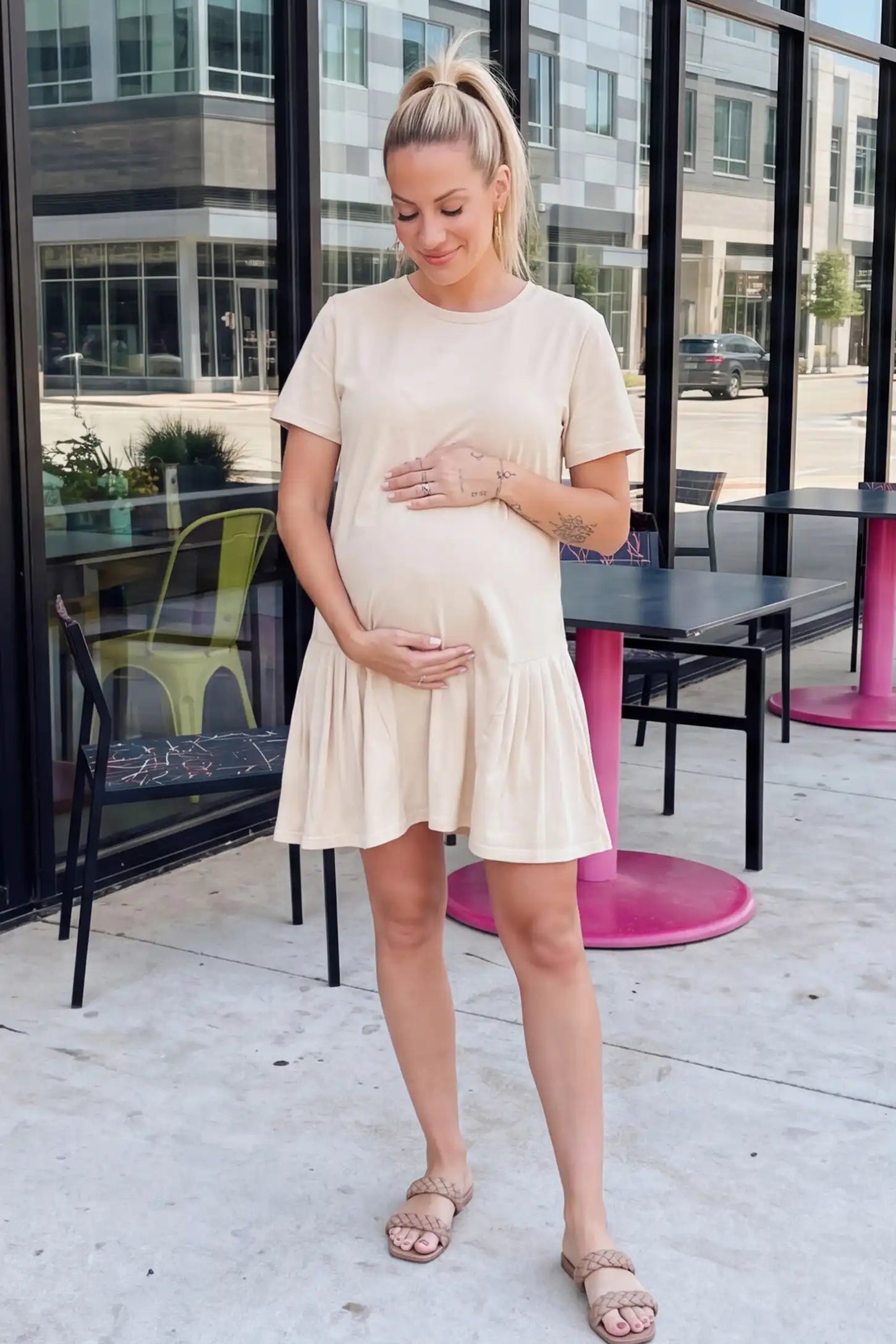 Pleated Hem A-line Maternity Short Dress Pleated hem A-line maternity short dress in beige with classic round neckline, front view on pregnant model