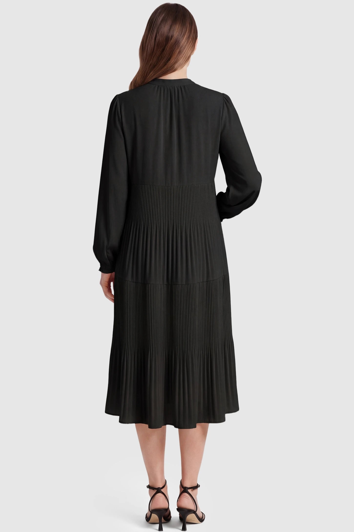 Button-Up Neck Pleated Tiered Maternity Midi Dress Button-up neck pleated tiered maternity midi dress in black with soft pleated design, back view on pregnant model