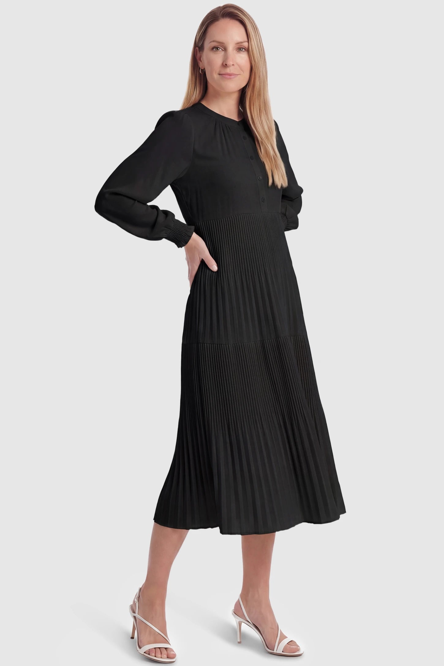 Button-Up Neck Pleated Tiered Maternity Midi Dress Button-up neck pleated tiered maternity midi dress in black with soft pleated design, front view on postpartum model