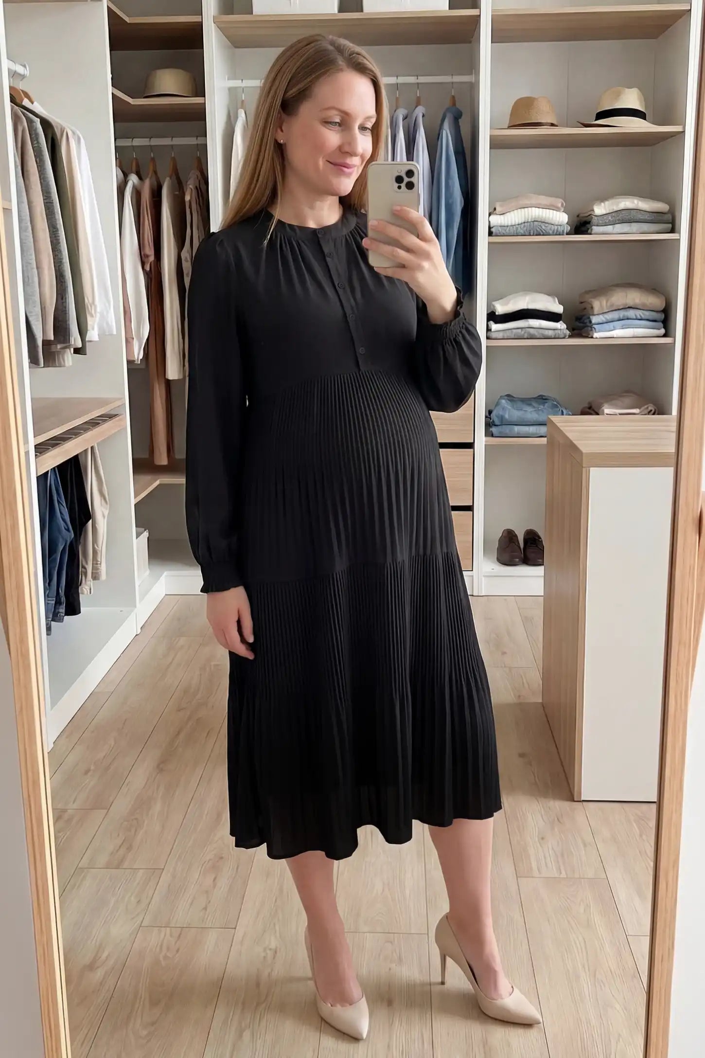 Button-Up Neck Pleated Tiered Maternity Midi Dress Button-up neck pleated tiered maternity midi dress in black with soft pleated design, front view on pregnant model