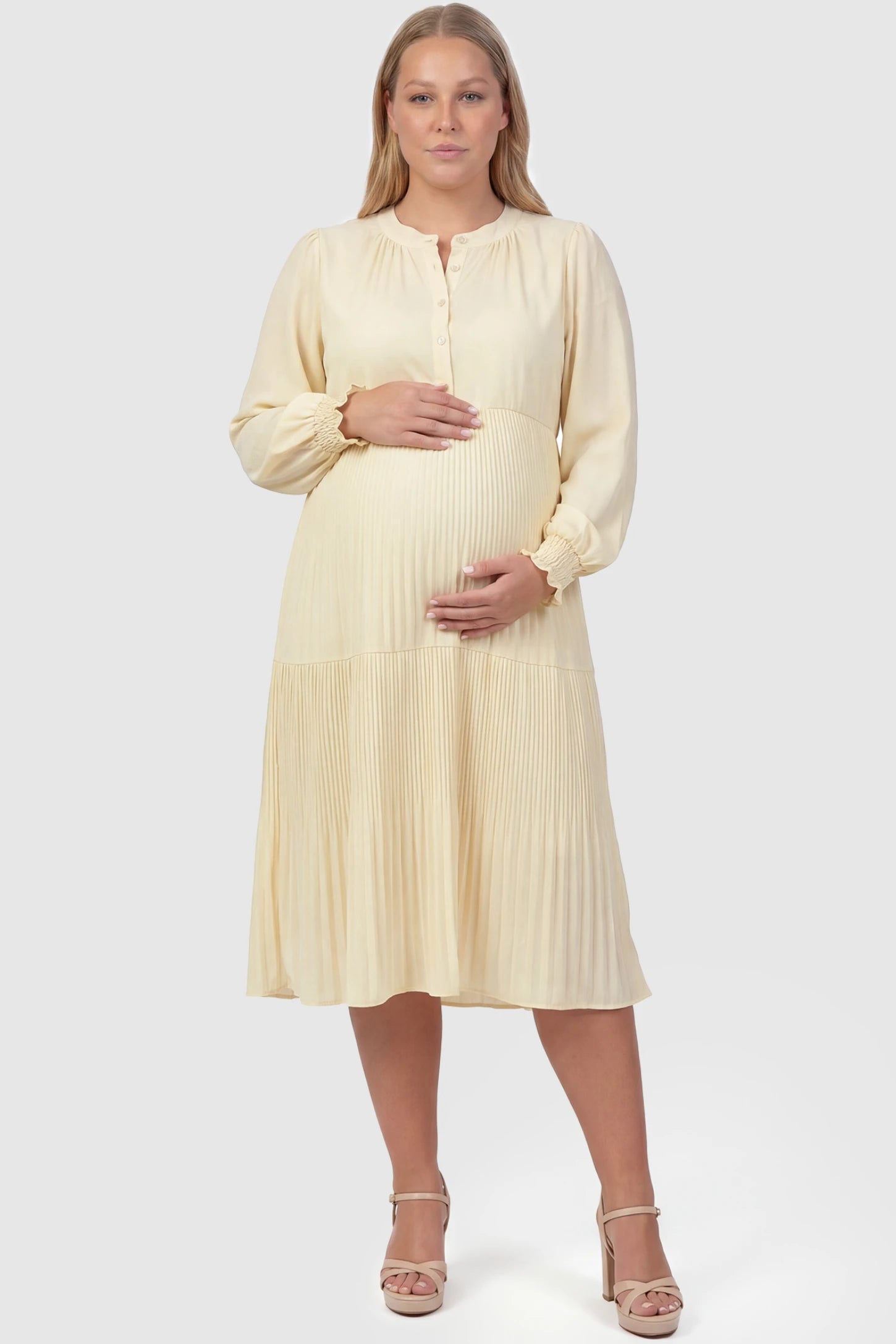Button-Up Neck Pleated Tiered Maternity Midi Dress Button-up neck pleated tiered maternity midi dress in pale yellow with soft pleated design, front view on plus-size model