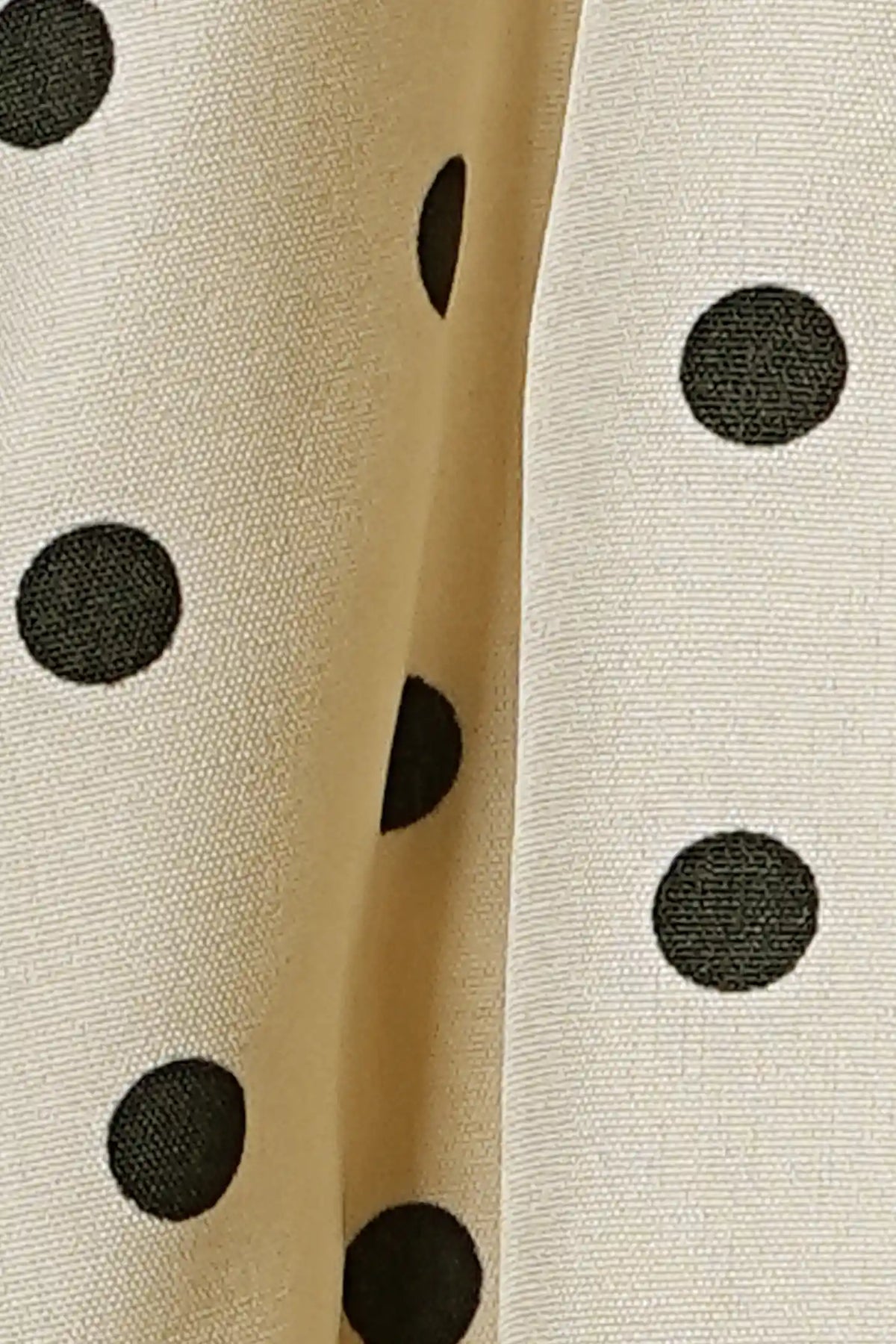 Polka Dot Round Neck Flowy Maternity Top Polka Dot Round Neck Flowy Maternity Top in Beige featuring a close-up view of the lightweight polyester-elastane fabric, soft texture, stretch material, and classic polka dot pattern.
